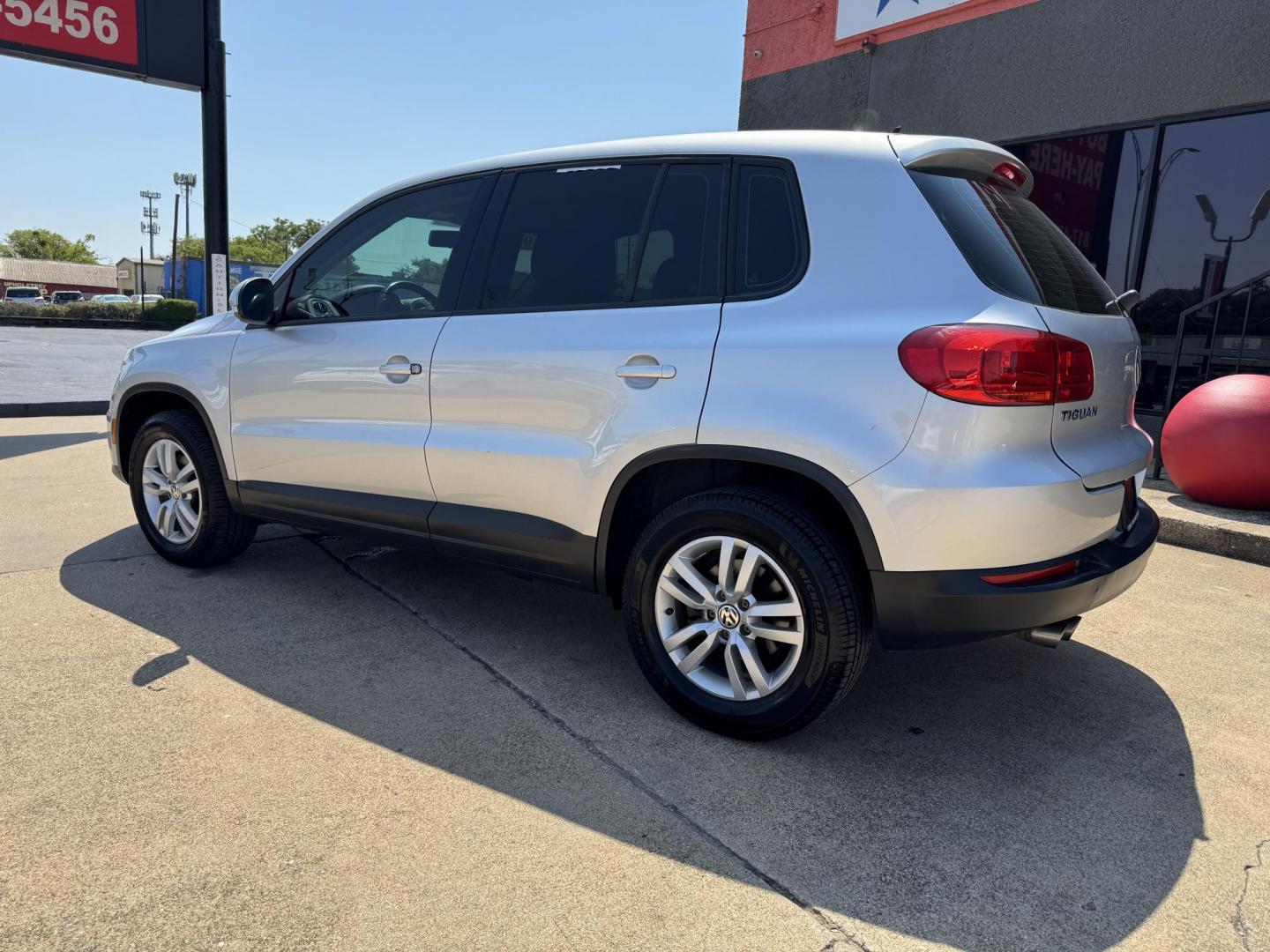 2014 SILVER /BLACK VOLKSWAGEN TIGUAN S; SE; SEL; W S (WVGAV3AX2EW) with an 2.0L Turbocharged 4-Cylinder engine, 6-Speed Automatic transmission, located at 5900 E. Lancaster Ave., Fort Worth, TX, 76112, (817) 457-5456, 0.000000, 0.000000 - Sporty and versatile, this Tiguan features a 2.0L turbocharged engine, seating for 5 passengers, and up to 23.8 cu. ft. of cargo space. Enjoy features like black cloth interior, power locks, ABS, and stability control—a compact SUV with German engineering, efficiency, and comfort all in one. - Photo#6