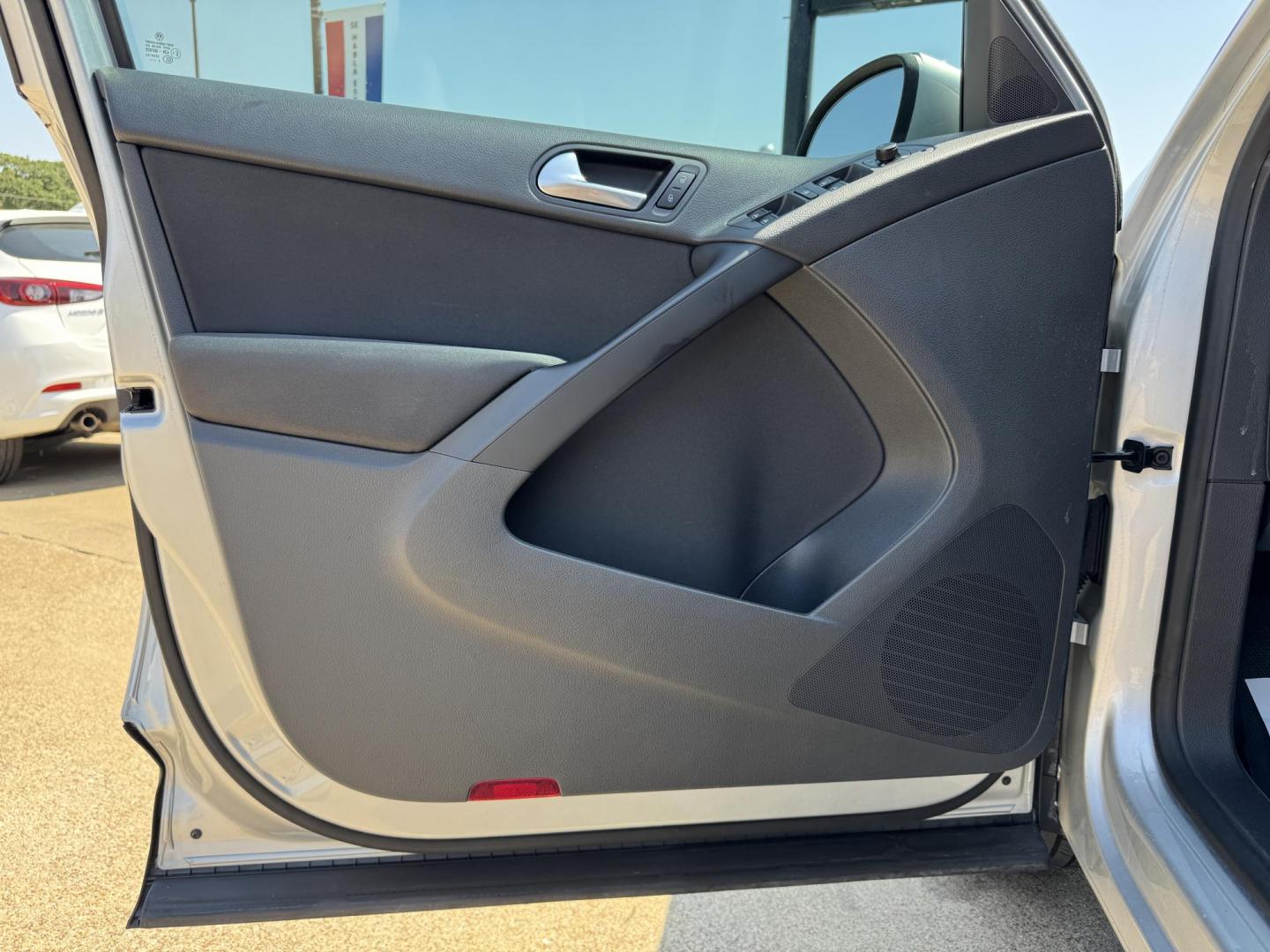 2014 SILVER /BLACK VOLKSWAGEN TIGUAN S; SE; SEL; W S (WVGAV3AX2EW) with an 2.0L Turbocharged 4-Cylinder engine, 6-Speed Automatic transmission, located at 5900 E. Lancaster Ave., Fort Worth, TX, 76112, (817) 457-5456, 0.000000, 0.000000 - Sporty and versatile, this Tiguan features a 2.0L turbocharged engine, seating for 5 passengers, and up to 23.8 cu. ft. of cargo space. Enjoy features like black cloth interior, power locks, ABS, and stability control—a compact SUV with German engineering, efficiency, and comfort all in one. - Photo#7