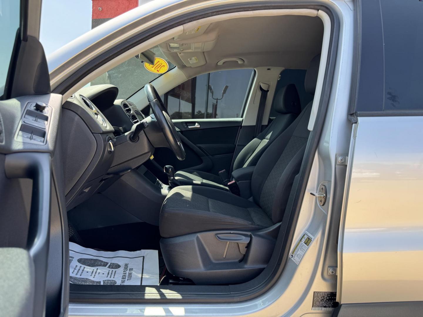 2014 SILVER /BLACK VOLKSWAGEN TIGUAN S; SE; SEL; W S (WVGAV3AX2EW) with an 2.0L Turbocharged 4-Cylinder engine, 6-Speed Automatic transmission, located at 5900 E. Lancaster Ave., Fort Worth, TX, 76112, (817) 457-5456, 0.000000, 0.000000 - Sporty and versatile, this Tiguan features a 2.0L turbocharged engine, seating for 5 passengers, and up to 23.8 cu. ft. of cargo space. Enjoy features like black cloth interior, power locks, ABS, and stability control—a compact SUV with German engineering, efficiency, and comfort all in one. - Photo#8