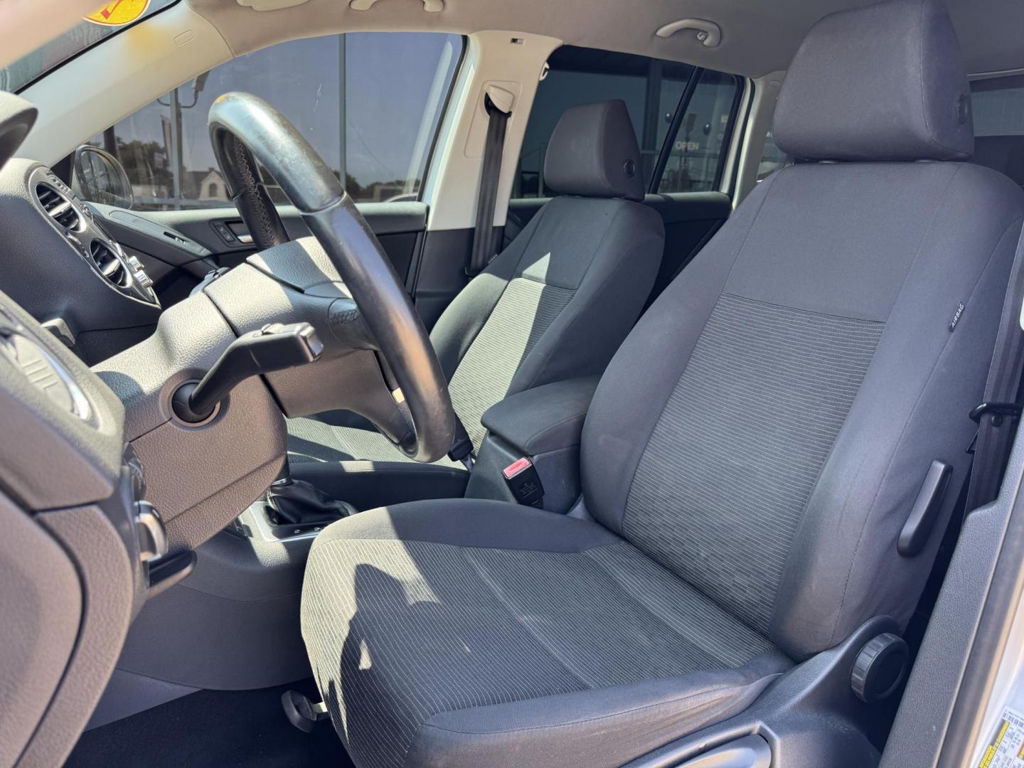 2014 SILVER /BLACK VOLKSWAGEN TIGUAN S; SE; SEL; W S (WVGAV3AX2EW) with an 2.0L Turbocharged 4-Cylinder engine, 6-Speed Automatic transmission, located at 5900 E. Lancaster Ave., Fort Worth, TX, 76112, (817) 457-5456, 0.000000, 0.000000 - Sporty and versatile, this Tiguan features a 2.0L turbocharged engine, seating for 5 passengers, and up to 23.8 cu. ft. of cargo space. Enjoy features like black cloth interior, power locks, ABS, and stability control—a compact SUV with German engineering, efficiency, and comfort all in one. - Photo#9