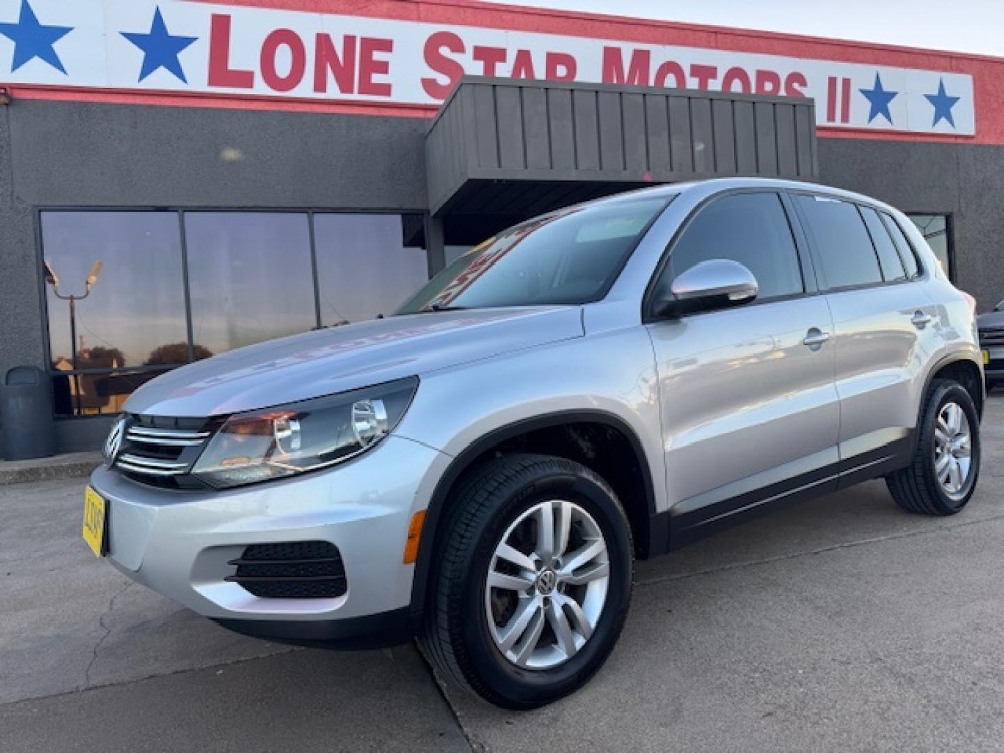 2014 SILVER /BLACK VOLKSWAGEN TIGUAN S; SE; SEL; W S (WVGAV3AX2EW) with an 2.0L engine, 6-Speed Automatic transmission, located at 5900 E. Lancaster Ave., Fort Worth, TX, 76112, (817) 457-5456, 0.000000, 0.000000 - Sporty and versatile, this Tiguan features a 2.0L turbocharged engine, seating for 5 passengers, and up to 23.8 cu. ft. of cargo space. Enjoy features like black cloth interior, power locks, ABS, and stability control—a compact SUV with German engineering, efficiency, and comfort all in one. - Photo#23