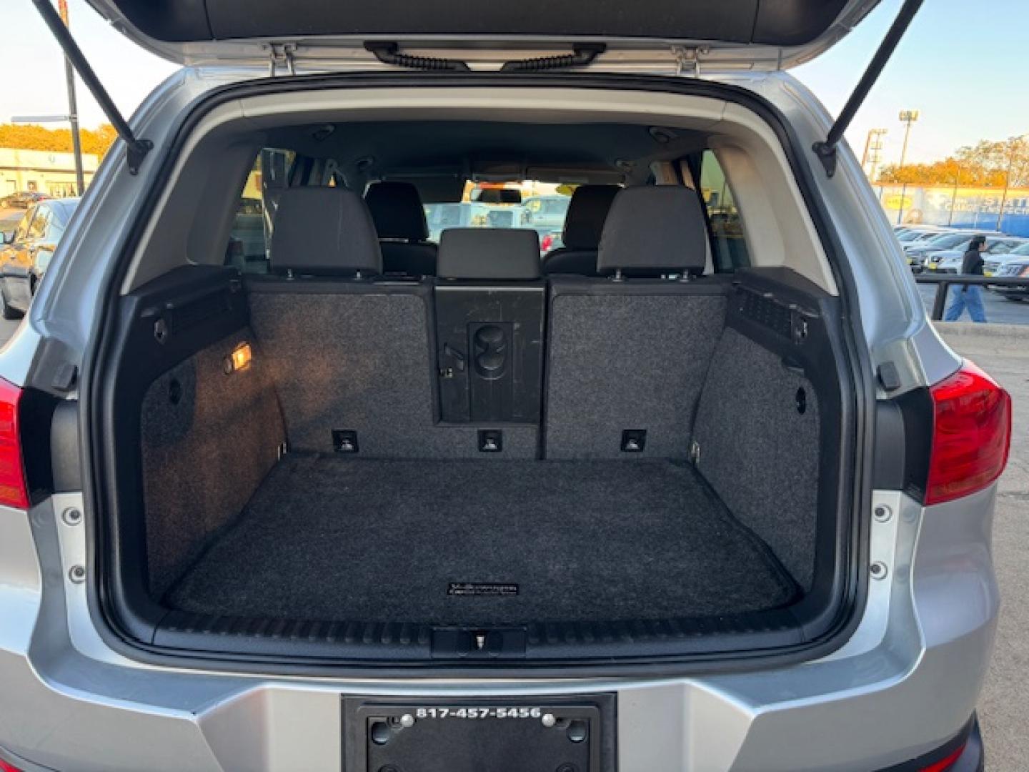 2014 SILVER /BLACK VOLKSWAGEN TIGUAN S; SE; SEL; W S (WVGAV3AX2EW) with an 2.0L engine, 6-Speed Automatic transmission, located at 5900 E. Lancaster Ave., Fort Worth, TX, 76112, (817) 457-5456, 0.000000, 0.000000 - Sporty and versatile, this Tiguan features a 2.0L turbocharged engine, seating for 5 passengers, and up to 23.8 cu. ft. of cargo space. Enjoy features like black cloth interior, power locks, ABS, and stability control—a compact SUV with German engineering, efficiency, and comfort all in one. - Photo#28