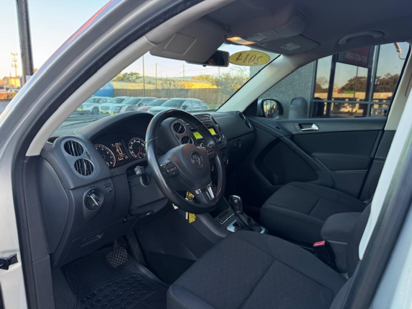 2014 SILVER /BLACK VOLKSWAGEN TIGUAN S; SE; SEL; W S (WVGAV3AX2EW) with an 2.0L engine, 6-Speed Automatic transmission, located at 5900 E. Lancaster Ave., Fort Worth, TX, 76112, (817) 457-5456, 0.000000, 0.000000 - Sporty and versatile, this Tiguan features a 2.0L turbocharged engine, seating for 5 passengers, and up to 23.8 cu. ft. of cargo space. Enjoy features like black cloth interior, power locks, ABS, and stability control—a compact SUV with German engineering, efficiency, and comfort all in one. - Photo#31