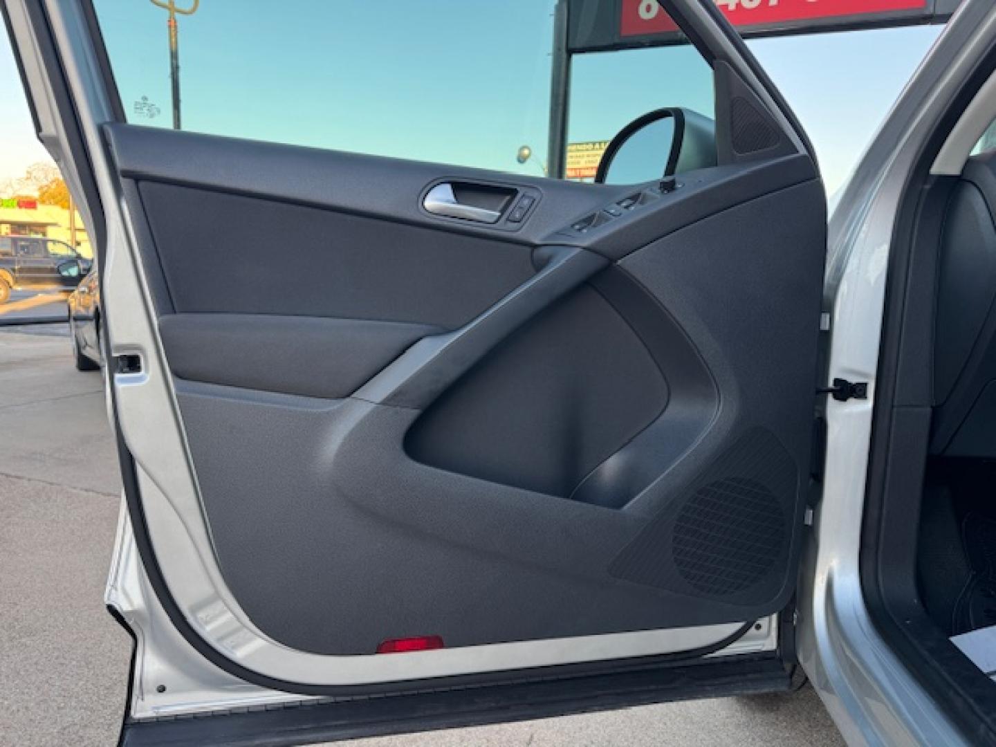 2014 SILVER /BLACK VOLKSWAGEN TIGUAN S; SE; SEL; W S (WVGAV3AX2EW) with an 2.0L engine, 6-Speed Automatic transmission, located at 5900 E. Lancaster Ave., Fort Worth, TX, 76112, (817) 457-5456, 0.000000, 0.000000 - Sporty and versatile, this Tiguan features a 2.0L turbocharged engine, seating for 5 passengers, and up to 23.8 cu. ft. of cargo space. Enjoy features like black cloth interior, power locks, ABS, and stability control—a compact SUV with German engineering, efficiency, and comfort all in one. - Photo#30