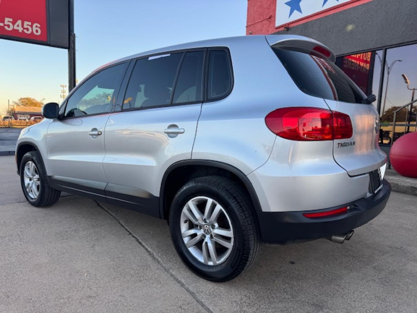 2014 SILVER /BLACK VOLKSWAGEN TIGUAN S; SE; SEL; W S (WVGAV3AX2EW) with an 2.0L engine, 6-Speed Automatic transmission, located at 5900 E. Lancaster Ave., Fort Worth, TX, 76112, (817) 457-5456, 0.000000, 0.000000 - Sporty and versatile, this Tiguan features a 2.0L turbocharged engine, seating for 5 passengers, and up to 23.8 cu. ft. of cargo space. Enjoy features like black cloth interior, power locks, ABS, and stability control—a compact SUV with German engineering, efficiency, and comfort all in one. - Photo#29