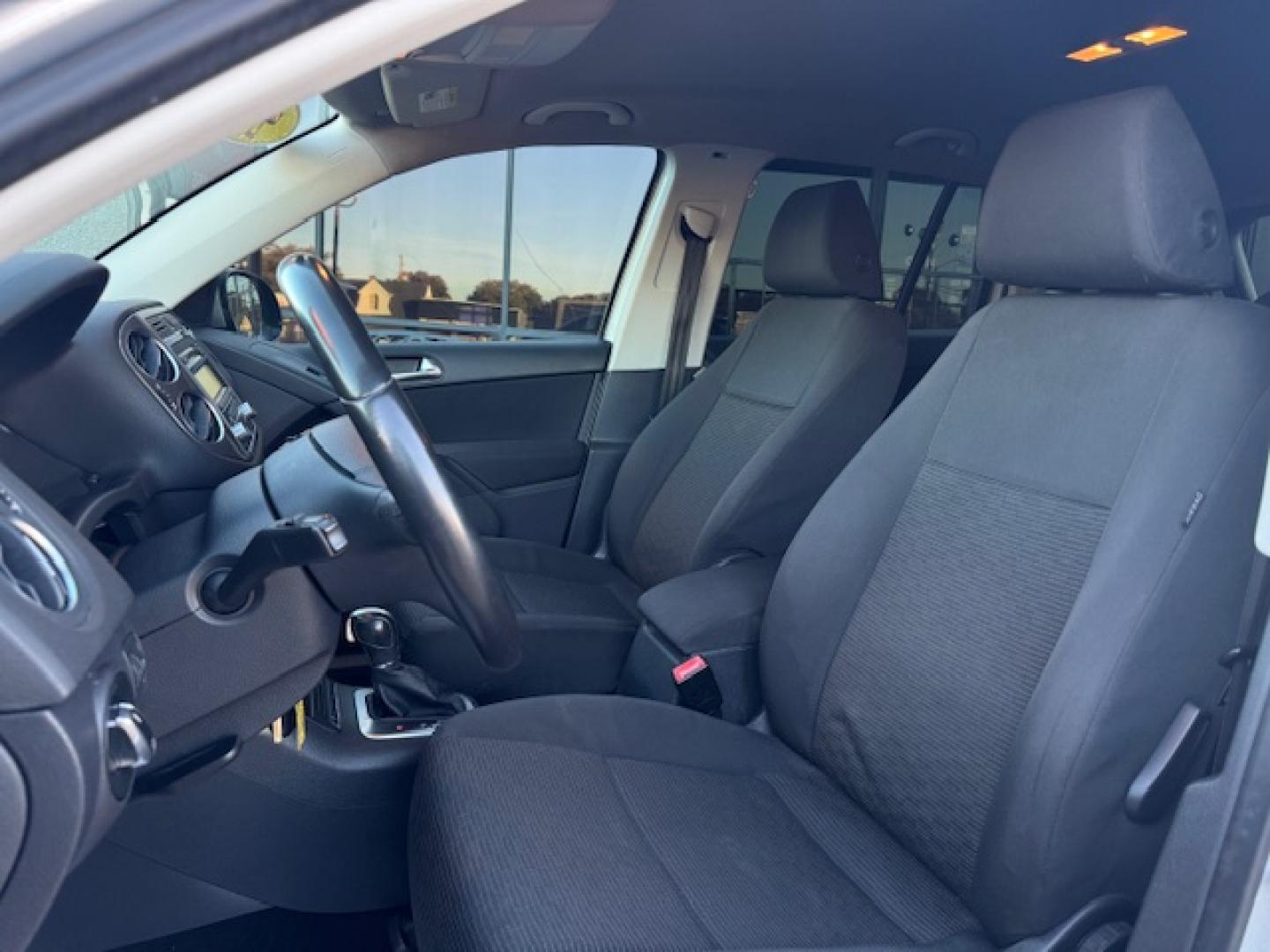 2014 SILVER /BLACK VOLKSWAGEN TIGUAN S; SE; SEL; W S (WVGAV3AX2EW) with an 2.0L engine, 6-Speed Automatic transmission, located at 5900 E. Lancaster Ave., Fort Worth, TX, 76112, (817) 457-5456, 0.000000, 0.000000 - Sporty and versatile, this Tiguan features a 2.0L turbocharged engine, seating for 5 passengers, and up to 23.8 cu. ft. of cargo space. Enjoy features like black cloth interior, power locks, ABS, and stability control—a compact SUV with German engineering, efficiency, and comfort all in one. - Photo#32