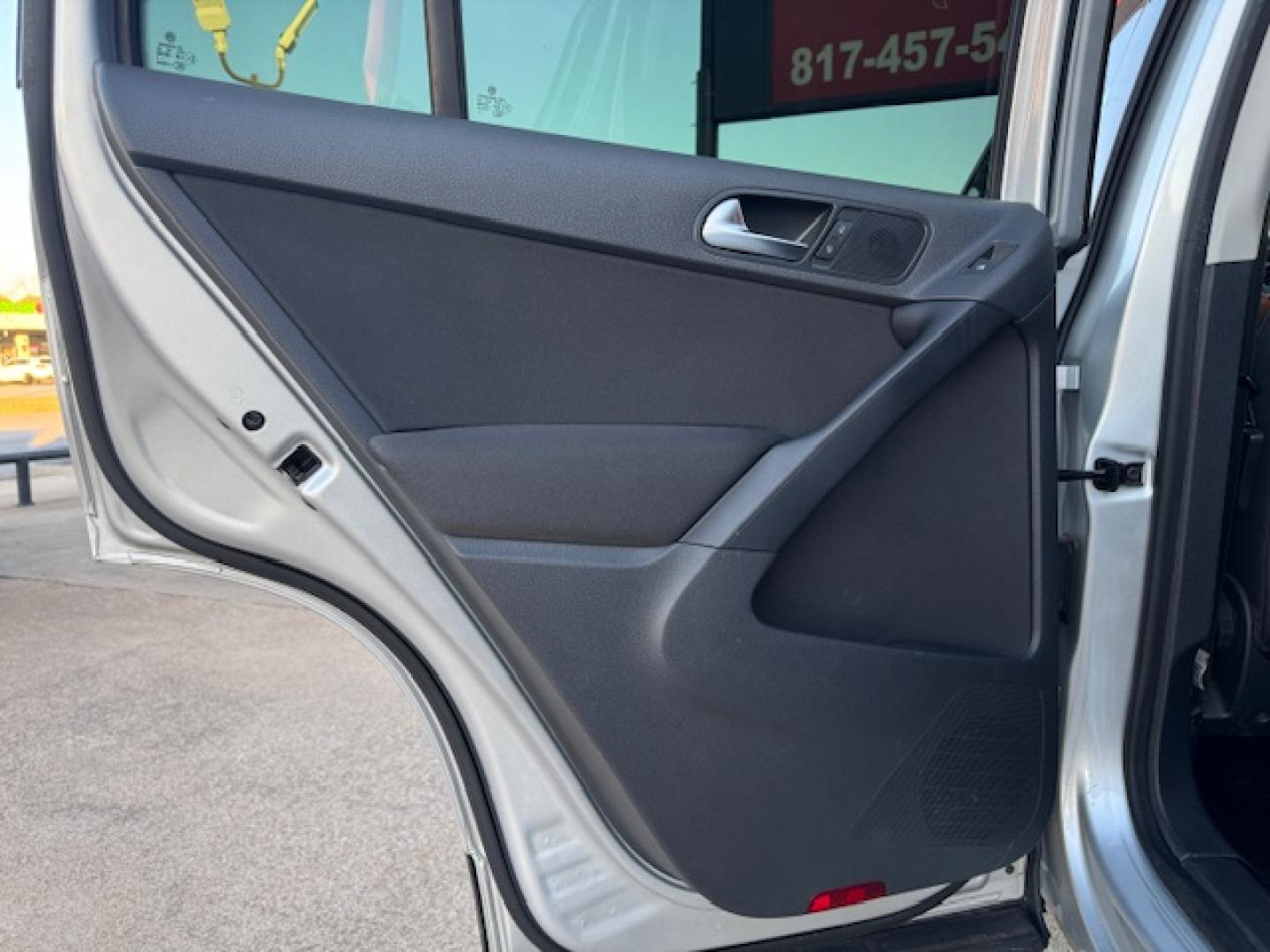 2014 SILVER /BLACK VOLKSWAGEN TIGUAN S; SE; SEL; W S (WVGAV3AX2EW) with an 2.0L engine, 6-Speed Automatic transmission, located at 5900 E. Lancaster Ave., Fort Worth, TX, 76112, (817) 457-5456, 0.000000, 0.000000 - Sporty and versatile, this Tiguan features a 2.0L turbocharged engine, seating for 5 passengers, and up to 23.8 cu. ft. of cargo space. Enjoy features like black cloth interior, power locks, ABS, and stability control—a compact SUV with German engineering, efficiency, and comfort all in one. - Photo#33