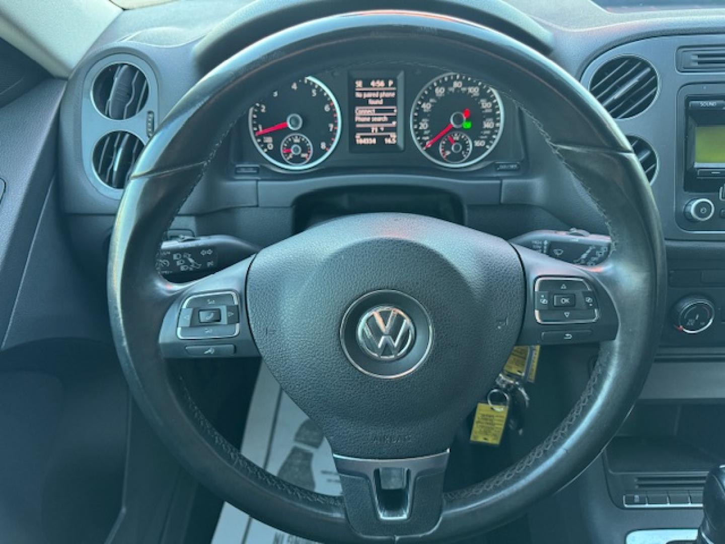 2014 SILVER /BLACK VOLKSWAGEN TIGUAN S; SE; SEL; W S (WVGAV3AX2EW) with an 2.0L engine, 6-Speed Automatic transmission, located at 5900 E. Lancaster Ave., Fort Worth, TX, 76112, (817) 457-5456, 0.000000, 0.000000 - Sporty and versatile, this Tiguan features a 2.0L turbocharged engine, seating for 5 passengers, and up to 23.8 cu. ft. of cargo space. Enjoy features like black cloth interior, power locks, ABS, and stability control—a compact SUV with German engineering, efficiency, and comfort all in one. - Photo#36