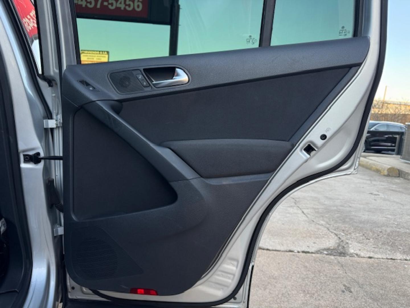 2014 SILVER /BLACK VOLKSWAGEN TIGUAN S; SE; SEL; W S (WVGAV3AX2EW) with an 2.0L engine, 6-Speed Automatic transmission, located at 5900 E. Lancaster Ave., Fort Worth, TX, 76112, (817) 457-5456, 0.000000, 0.000000 - Sporty and versatile, this Tiguan features a 2.0L turbocharged engine, seating for 5 passengers, and up to 23.8 cu. ft. of cargo space. Enjoy features like black cloth interior, power locks, ABS, and stability control—a compact SUV with German engineering, efficiency, and comfort all in one. - Photo#38