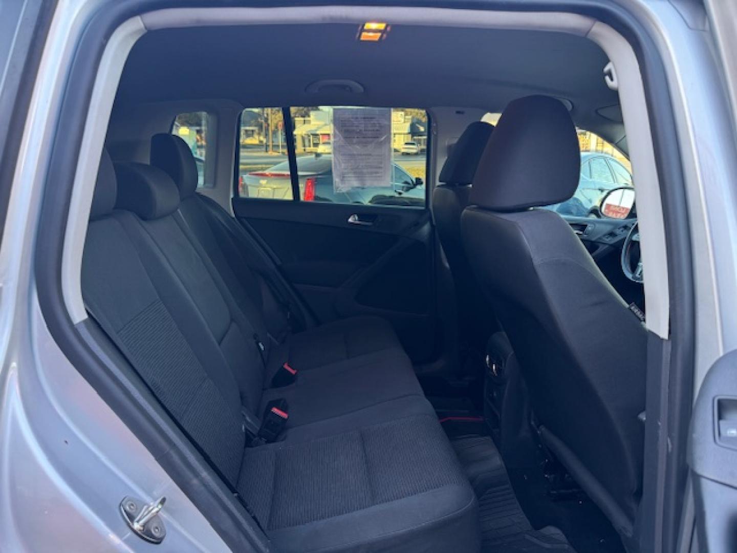 2014 SILVER /BLACK VOLKSWAGEN TIGUAN S; SE; SEL; W S (WVGAV3AX2EW) with an 2.0L engine, 6-Speed Automatic transmission, located at 5900 E. Lancaster Ave., Fort Worth, TX, 76112, (817) 457-5456, 0.000000, 0.000000 - Sporty and versatile, this Tiguan features a 2.0L turbocharged engine, seating for 5 passengers, and up to 23.8 cu. ft. of cargo space. Enjoy features like black cloth interior, power locks, ABS, and stability control—a compact SUV with German engineering, efficiency, and comfort all in one. - Photo#39