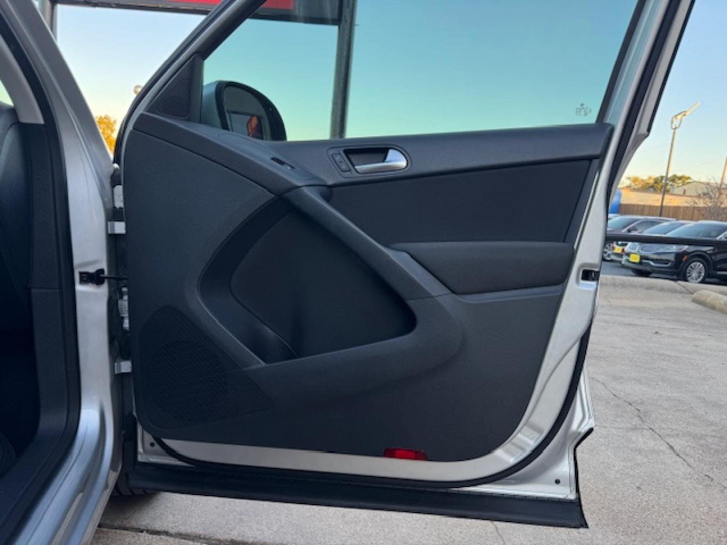 2014 SILVER /BLACK VOLKSWAGEN TIGUAN S; SE; SEL; W S (WVGAV3AX2EW) with an 2.0L engine, 6-Speed Automatic transmission, located at 5900 E. Lancaster Ave., Fort Worth, TX, 76112, (817) 457-5456, 0.000000, 0.000000 - Sporty and versatile, this Tiguan features a 2.0L turbocharged engine, seating for 5 passengers, and up to 23.8 cu. ft. of cargo space. Enjoy features like black cloth interior, power locks, ABS, and stability control—a compact SUV with German engineering, efficiency, and comfort all in one. - Photo#40