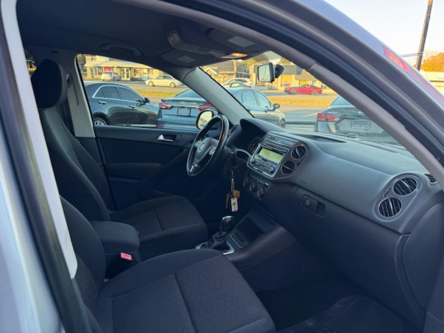 2014 SILVER /BLACK VOLKSWAGEN TIGUAN S; SE; SEL; W S (WVGAV3AX2EW) with an 2.0L engine, 6-Speed Automatic transmission, located at 5900 E. Lancaster Ave., Fort Worth, TX, 76112, (817) 457-5456, 0.000000, 0.000000 - Sporty and versatile, this Tiguan features a 2.0L turbocharged engine, seating for 5 passengers, and up to 23.8 cu. ft. of cargo space. Enjoy features like black cloth interior, power locks, ABS, and stability control—a compact SUV with German engineering, efficiency, and comfort all in one. - Photo#41