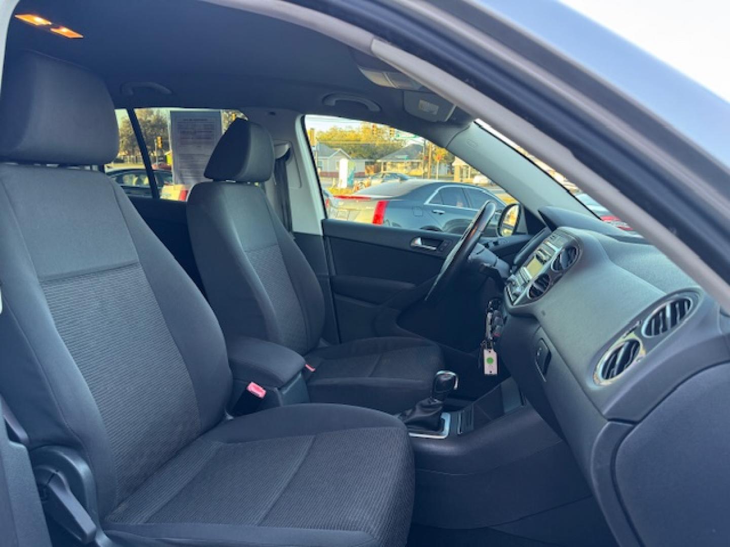 2014 SILVER /BLACK VOLKSWAGEN TIGUAN S; SE; SEL; W S (WVGAV3AX2EW) with an 2.0L engine, 6-Speed Automatic transmission, located at 5900 E. Lancaster Ave., Fort Worth, TX, 76112, (817) 457-5456, 0.000000, 0.000000 - Sporty and versatile, this Tiguan features a 2.0L turbocharged engine, seating for 5 passengers, and up to 23.8 cu. ft. of cargo space. Enjoy features like black cloth interior, power locks, ABS, and stability control—a compact SUV with German engineering, efficiency, and comfort all in one. - Photo#42