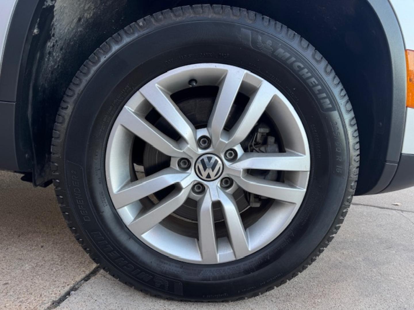 2014 SILVER /BLACK VOLKSWAGEN TIGUAN S; SE; SEL; W S (WVGAV3AX2EW) with an 2.0L engine, 6-Speed Automatic transmission, located at 5900 E. Lancaster Ave., Fort Worth, TX, 76112, (817) 457-5456, 0.000000, 0.000000 - Sporty and versatile, this Tiguan features a 2.0L turbocharged engine, seating for 5 passengers, and up to 23.8 cu. ft. of cargo space. Enjoy features like black cloth interior, power locks, ABS, and stability control—a compact SUV with German engineering, efficiency, and comfort all in one. - Photo#43