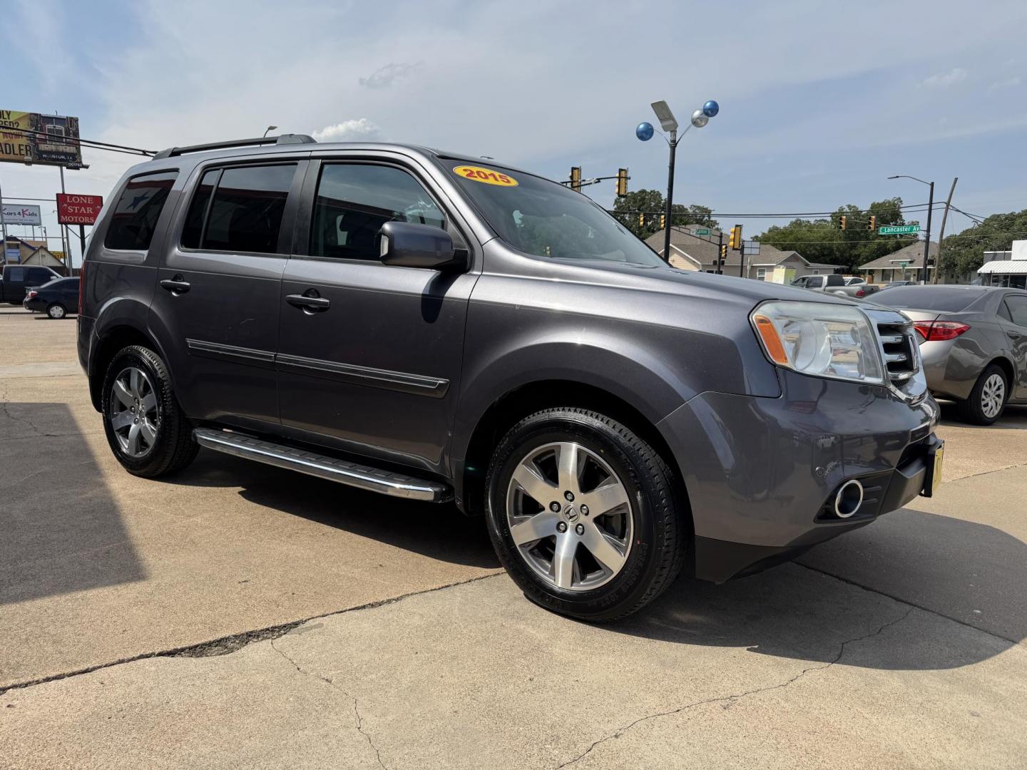 2015 GRAY /BLACK HONDA PILOT TOURING-RES Touring 2WD 5-Spd AT with DVD (5FNYF3H90FB) with an 3.5L engine, 5-Speed Automatic transmission, located at 5900 E. Lancaster Ave., Fort Worth, TX, 76112, (817) 457-5456, 0.000000, 0.000000 - The 2015 Honda Pilot Touring is a spacious 8-passenger SUV with a 3.5L V6, 5-speed automatic, leather seats, sunroof, heated front seats, dual-zone climate, rear power outlet, navigation, DVD system, and backup camera. A reliable family SUV with comfort, tech, and safety. - Photo#2