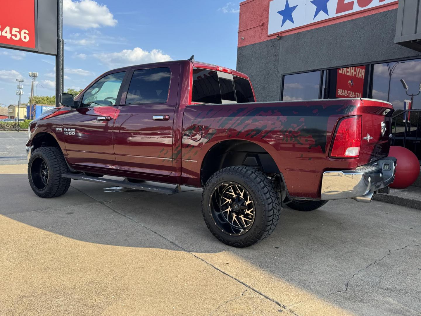 2016 RED /GRAY RAM 1500 SLT; BIG HORN; SLT CREW CAB (1C6RR7LT2GS) with an 5.7L engine, 8-Speed Automatic transmission, located at 5900 E. Lancaster Ave., Fort Worth, TX, 76112, (817) 457-5456, 0.000000, 0.000000 - Check out this 2016 RAM 1500 SLT Crew Cab 4x4, equipped with a 5.7L HEMI V8 and 8-speed automatic transmission. This lifted pickup offers selectable drive modes (2WD, 4WD Auto, 4WD Lock, 4WD Low), front and rear parking assist, tow/haul capability, and a backup camera for confidence on the road. Ins - Photo#6