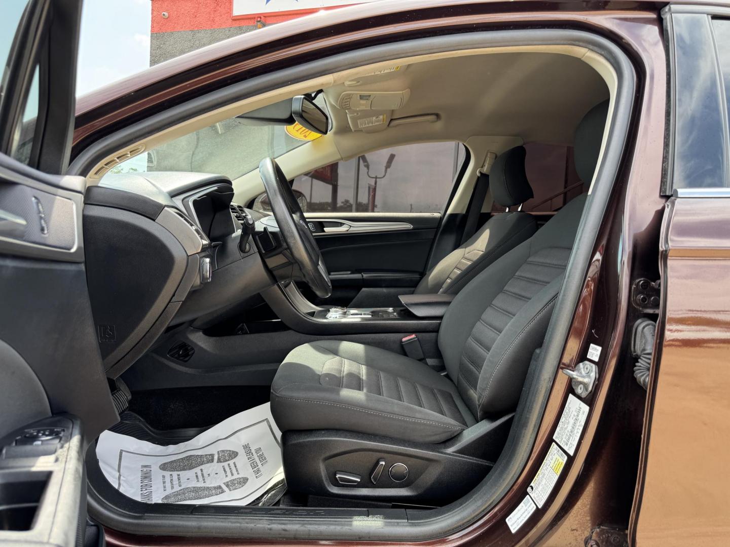 2019 RED FORD FUSION SE SE (3FA6P0HD5KR) with an 1.5L engine, 6-Speed Automatic transmission, located at 5900 E. Lancaster Ave., Fort Worth, TX, 76112, (817) 457-5456, 0.000000, 0.000000 - The 2019 Ford Fusion SE delivers efficiency and comfort with its 1.5L EcoBoost engine offering up to 34 MPG highway. Features include Bluetooth, backup camera, alloy wheels, and seating for five. A reliable sedan with modern technology and great fuel economy - Photo#8