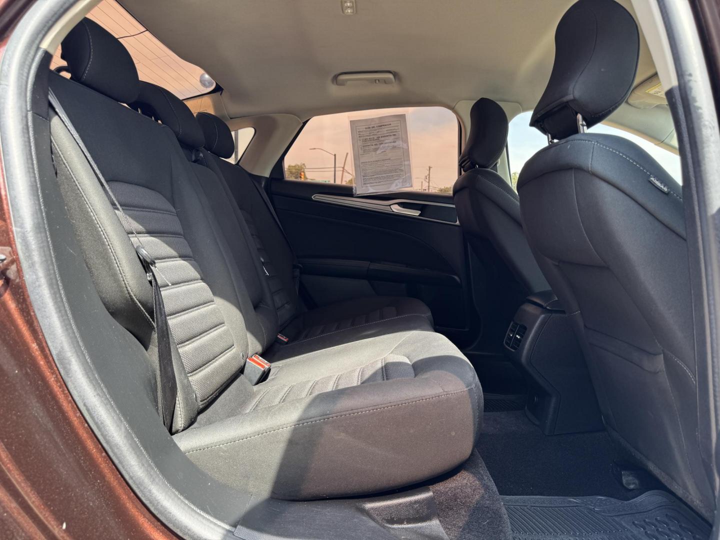 2019 RED FORD FUSION SE SE (3FA6P0HD5KR) with an 1.5L engine, 6-Speed Automatic transmission, located at 5900 E. Lancaster Ave., Fort Worth, TX, 76112, (817) 457-5456, 0.000000, 0.000000 - The 2019 Ford Fusion SE delivers efficiency and comfort with its 1.5L EcoBoost engine offering up to 34 MPG highway. Features include Bluetooth, backup camera, alloy wheels, and seating for five. A reliable sedan with modern technology and great fuel economy - Photo#13