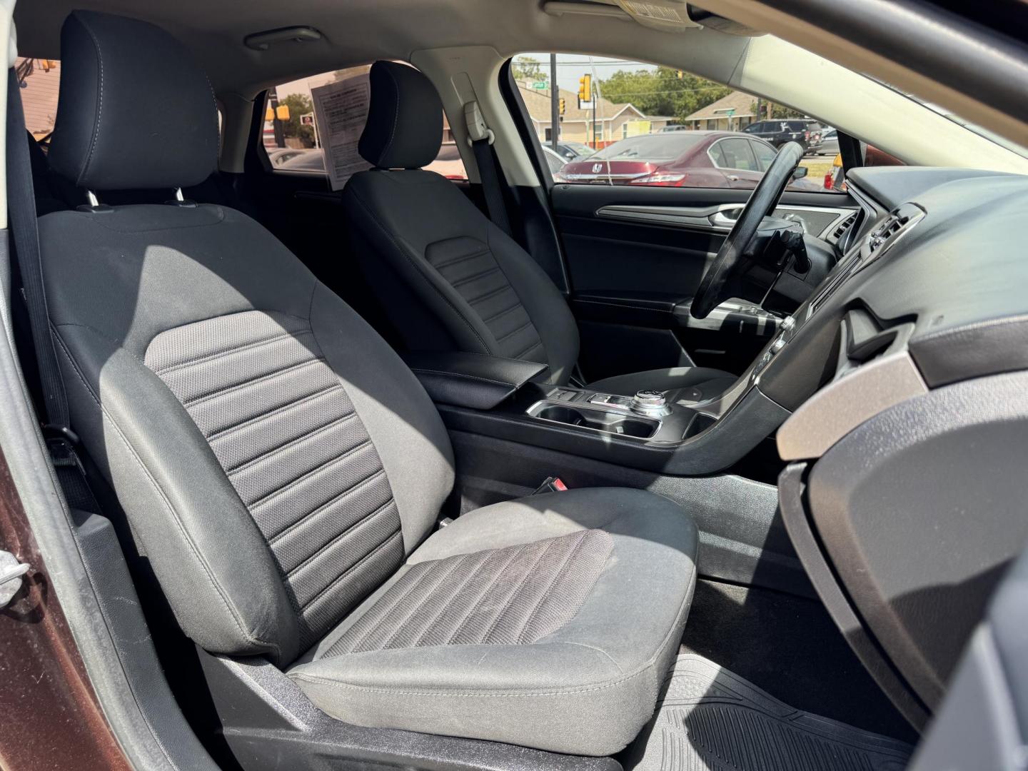 2019 RED FORD FUSION SE SE (3FA6P0HD5KR) with an 1.5L engine, 6-Speed Automatic transmission, located at 5900 E. Lancaster Ave., Fort Worth, TX, 76112, (817) 457-5456, 0.000000, 0.000000 - The 2019 Ford Fusion SE delivers efficiency and comfort with its 1.5L EcoBoost engine offering up to 34 MPG highway. Features include Bluetooth, backup camera, alloy wheels, and seating for five. A reliable sedan with modern technology and great fuel economy - Photo#16