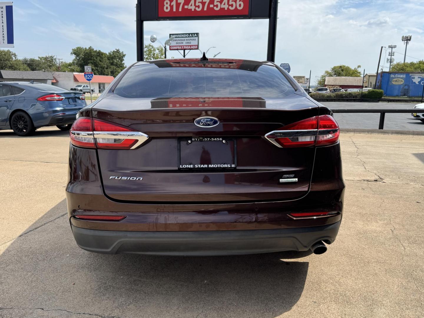 2019 RED FORD FUSION SE SE (3FA6P0HD5KR) with an 1.5L engine, 6-Speed Automatic transmission, located at 5900 E. Lancaster Ave., Fort Worth, TX, 76112, (817) 457-5456, 0.000000, 0.000000 - The 2019 Ford Fusion SE delivers efficiency and comfort with its 1.5L EcoBoost engine offering up to 34 MPG highway. Features include Bluetooth, backup camera, alloy wheels, and seating for five. A reliable sedan with modern technology and great fuel economy - Photo#4