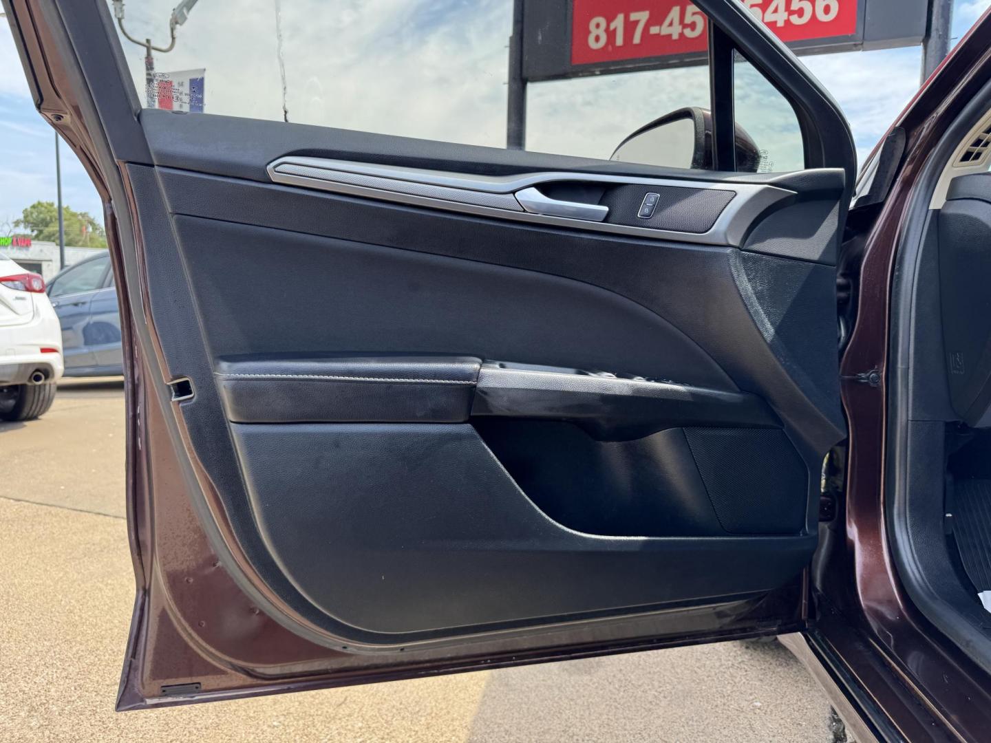2019 RED FORD FUSION SE SE (3FA6P0HD5KR) with an 1.5L engine, 6-Speed Automatic transmission, located at 5900 E. Lancaster Ave., Fort Worth, TX, 76112, (817) 457-5456, 0.000000, 0.000000 - The 2019 Ford Fusion SE delivers efficiency and comfort with its 1.5L EcoBoost engine offering up to 34 MPG highway. Features include Bluetooth, backup camera, alloy wheels, and seating for five. A reliable sedan with modern technology and great fuel economy - Photo#7