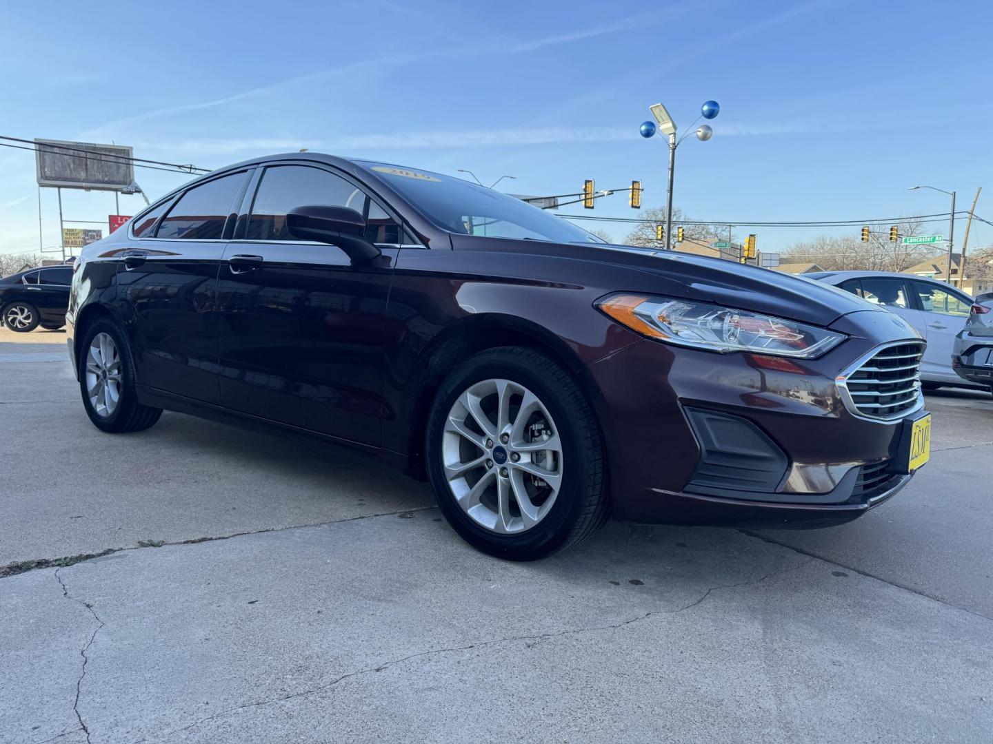 2019 BROWN FORD FUSION SE SE (3FA6P0HD5KR) with an 1.5L engine, 6-Speed Automatic transmission, located at 5900 E. Lancaster Ave., Fort Worth, TX, 76112, (817) 457-5456, 0.000000, 0.000000 - The 2019 Ford Fusion SE delivers efficiency and comfort with its 1.5L EcoBoost engine offering up to 34 MPG highway. Features include Bluetooth, backup camera, alloy wheels, and seating for five. A reliable sedan with modern technology and great fuel economy - Photo#2