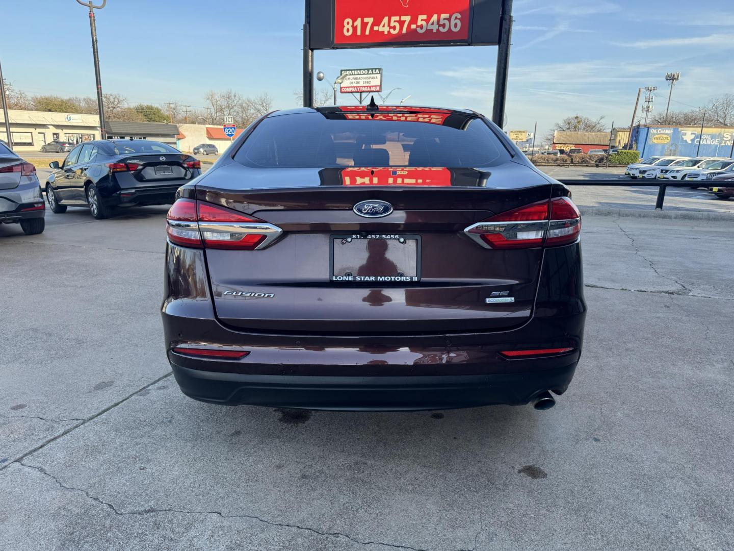 2019 BROWN FORD FUSION SE SE (3FA6P0HD5KR) with an 1.5L engine, 6-Speed Automatic transmission, located at 5900 E. Lancaster Ave., Fort Worth, TX, 76112, (817) 457-5456, 0.000000, 0.000000 - The 2019 Ford Fusion SE delivers efficiency and comfort with its 1.5L EcoBoost engine offering up to 34 MPG highway. Features include Bluetooth, backup camera, alloy wheels, and seating for five. A reliable sedan with modern technology and great fuel economy - Photo#4