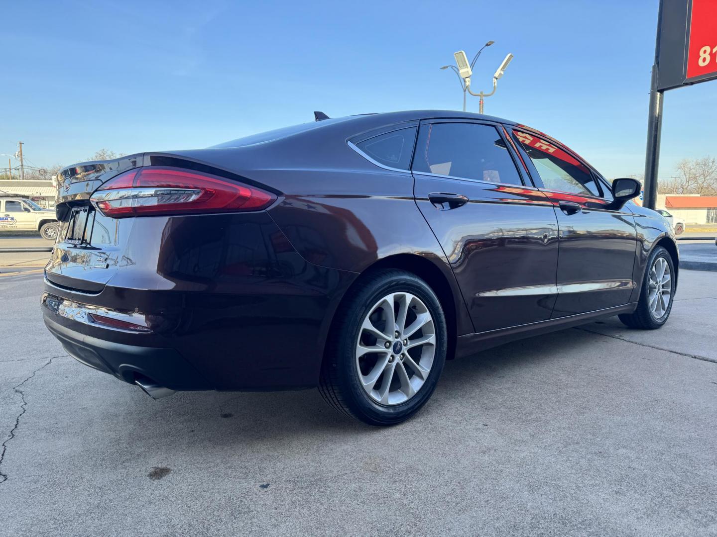 2019 BROWN FORD FUSION SE SE (3FA6P0HD5KR) with an 1.5L engine, 6-Speed Automatic transmission, located at 5900 E. Lancaster Ave., Fort Worth, TX, 76112, (817) 457-5456, 0.000000, 0.000000 - The 2019 Ford Fusion SE delivers efficiency and comfort with its 1.5L EcoBoost engine offering up to 34 MPG highway. Features include Bluetooth, backup camera, alloy wheels, and seating for five. A reliable sedan with modern technology and great fuel economy - Photo#3