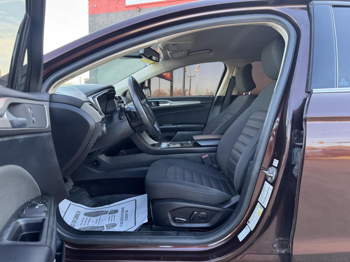 2019 BROWN FORD FUSION SE SE (3FA6P0HD5KR) with an 1.5L engine, 6-Speed Automatic transmission, located at 5900 E. Lancaster Ave., Fort Worth, TX, 76112, (817) 457-5456, 0.000000, 0.000000 - The 2019 Ford Fusion SE delivers efficiency and comfort with its 1.5L EcoBoost engine offering up to 34 MPG highway. Features include Bluetooth, backup camera, alloy wheels, and seating for five. A reliable sedan with modern technology and great fuel economy - Photo#8