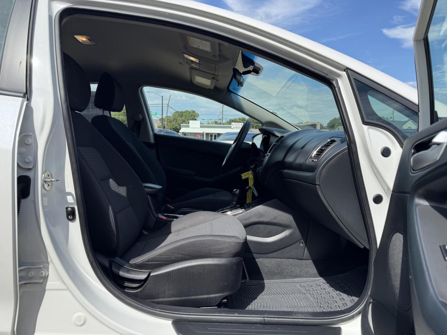 2018 WHITE /BLACK KIA FORTE LX; S LX (3KPFL4A70JE) with an 2.0L engine, 6-Speed Automatic transmission, located at 5900 E. Lancaster Ave., Fort Worth, TX, 76112, (817) 457-5456, 0.000000, 0.000000 - The 2018 Kia Forte LX combines efficiency and comfort with a 2.0L 4-cylinder engine, 6-speed automatic transmission, and impressive 29 city / 37 highway MPG. It seats five with spacious legroom and features a backup camera, phone connectivity, 4-wheel ABS disc brakes, and coil spring suspension. A r - Photo#15