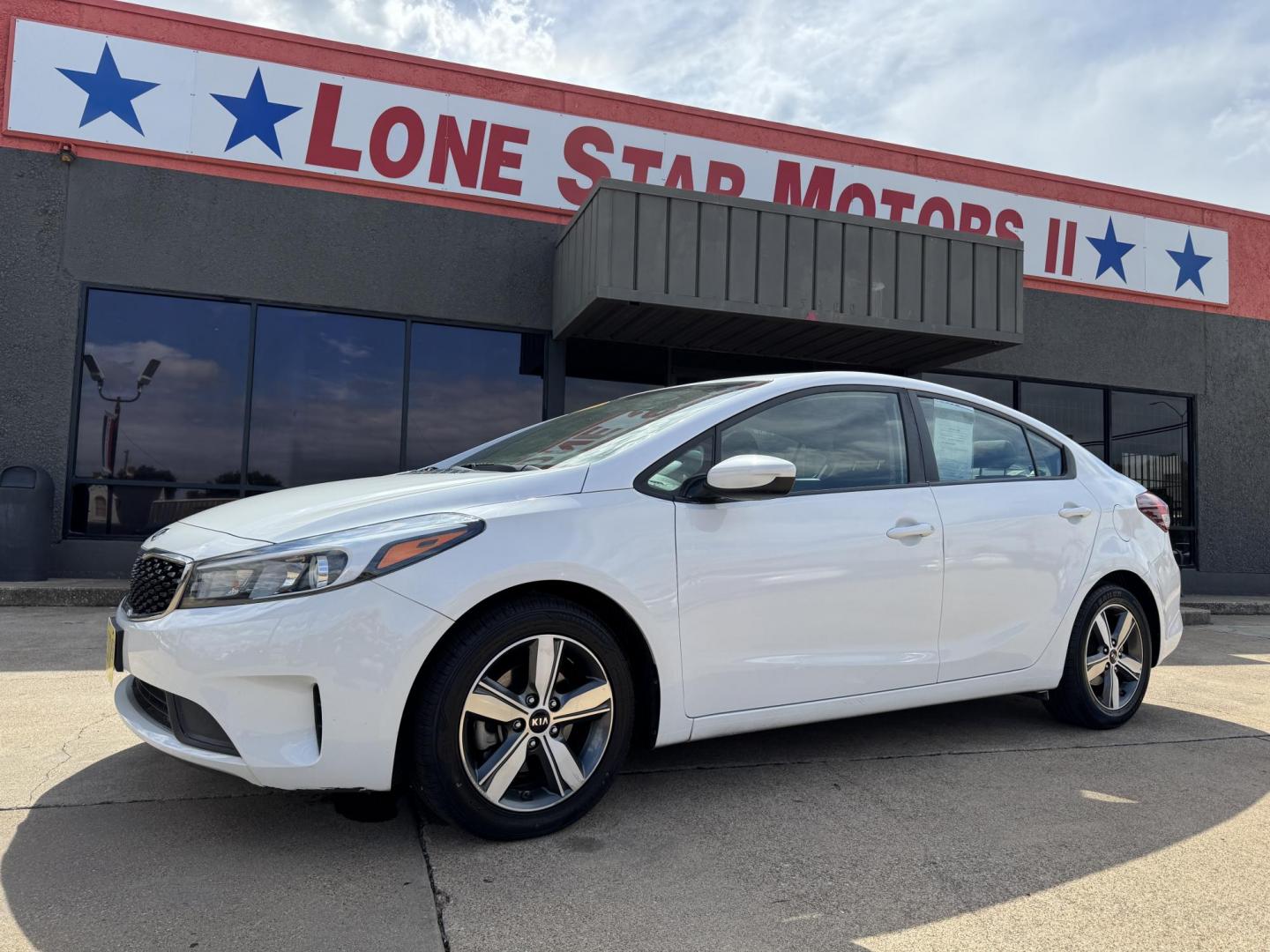 2018 WHITE /BLACK KIA FORTE LX; S LX (3KPFL4A70JE) with an 2.0L engine, 6-Speed Automatic transmission, located at 5900 E. Lancaster Ave., Fort Worth, TX, 76112, (817) 457-5456, 0.000000, 0.000000 - The 2018 Kia Forte LX combines efficiency and comfort with a 2.0L 4-cylinder engine, 6-speed automatic transmission, and impressive 29 city / 37 highway MPG. It seats five with spacious legroom and features a backup camera, phone connectivity, 4-wheel ABS disc brakes, and coil spring suspension. A r - Photo#0