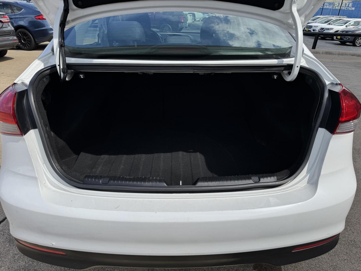 2018 WHITE /BLACK KIA FORTE LX; S LX (3KPFL4A70JE) with an 2.0L engine, 6-Speed Automatic transmission, located at 5900 E. Lancaster Ave., Fort Worth, TX, 76112, (817) 457-5456, 0.000000, 0.000000 - The 2018 Kia Forte LX combines efficiency and comfort with a 2.0L 4-cylinder engine, 6-speed automatic transmission, and impressive 29 city / 37 highway MPG. It seats five with spacious legroom and features a backup camera, phone connectivity, 4-wheel ABS disc brakes, and coil spring suspension. A r - Photo#5
