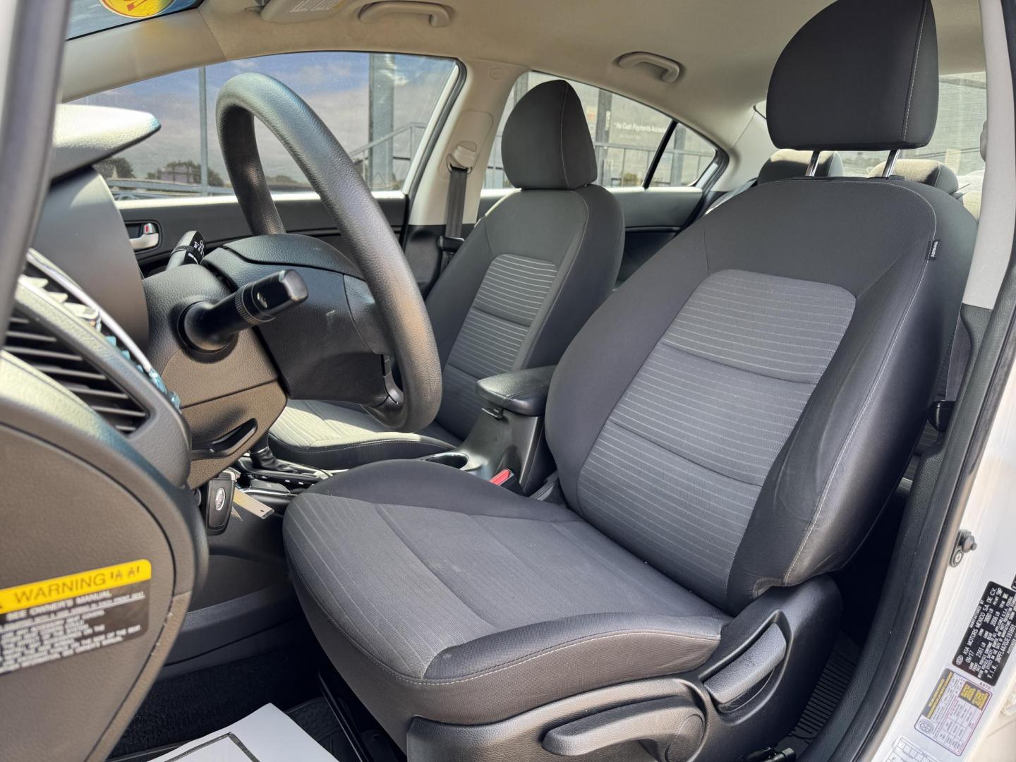 2018 WHITE /BLACK KIA FORTE LX; S LX (3KPFL4A70JE) with an 2.0L engine, 6-Speed Automatic transmission, located at 5900 E. Lancaster Ave., Fort Worth, TX, 76112, (817) 457-5456, 0.000000, 0.000000 - The 2018 Kia Forte LX combines efficiency and comfort with a 2.0L 4-cylinder engine, 6-speed automatic transmission, and impressive 29 city / 37 highway MPG. It seats five with spacious legroom and features a backup camera, phone connectivity, 4-wheel ABS disc brakes, and coil spring suspension. A r - Photo#9