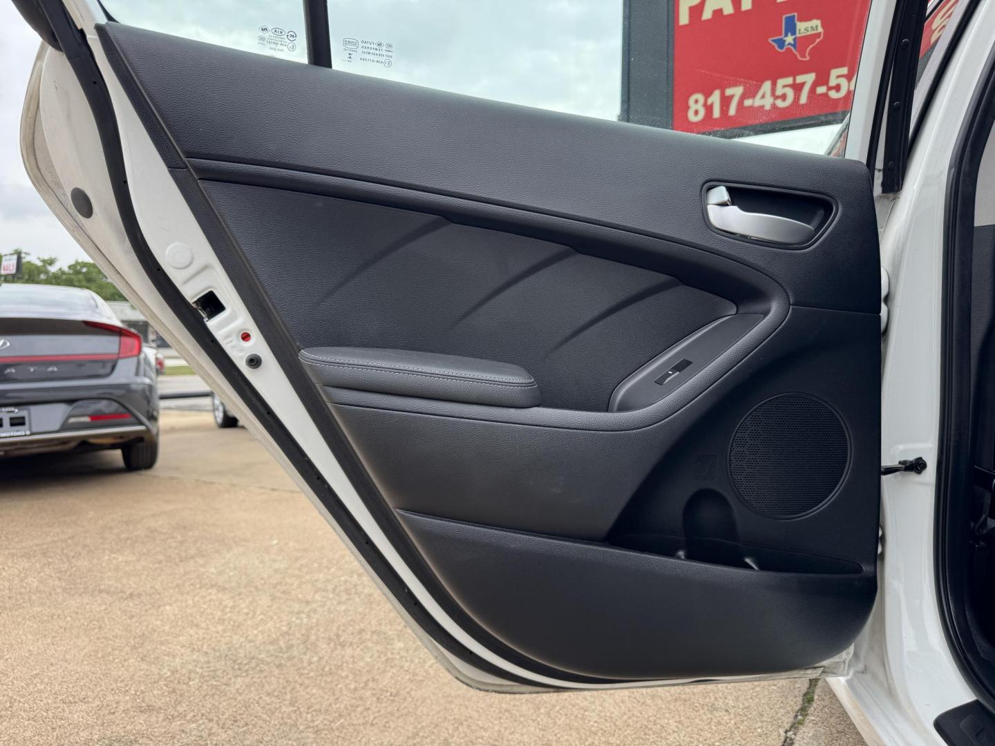 2018 WHITE /BLACK KIA FORTE LX; S LX (3KPFL4A70JE) with an 2.0L engine, 6-Speed Automatic transmission, located at 5900 E. Lancaster Ave., Fort Worth, TX, 76112, (817) 457-5456, 0.000000, 0.000000 - The 2018 Kia Forte LX combines efficiency and comfort with a 2.0L 4-cylinder engine, 6-speed automatic transmission, and impressive 29 city / 37 highway MPG. It seats five with spacious legroom and features a backup camera, phone connectivity, 4-wheel ABS disc brakes, and coil spring suspension. A r - Photo#11