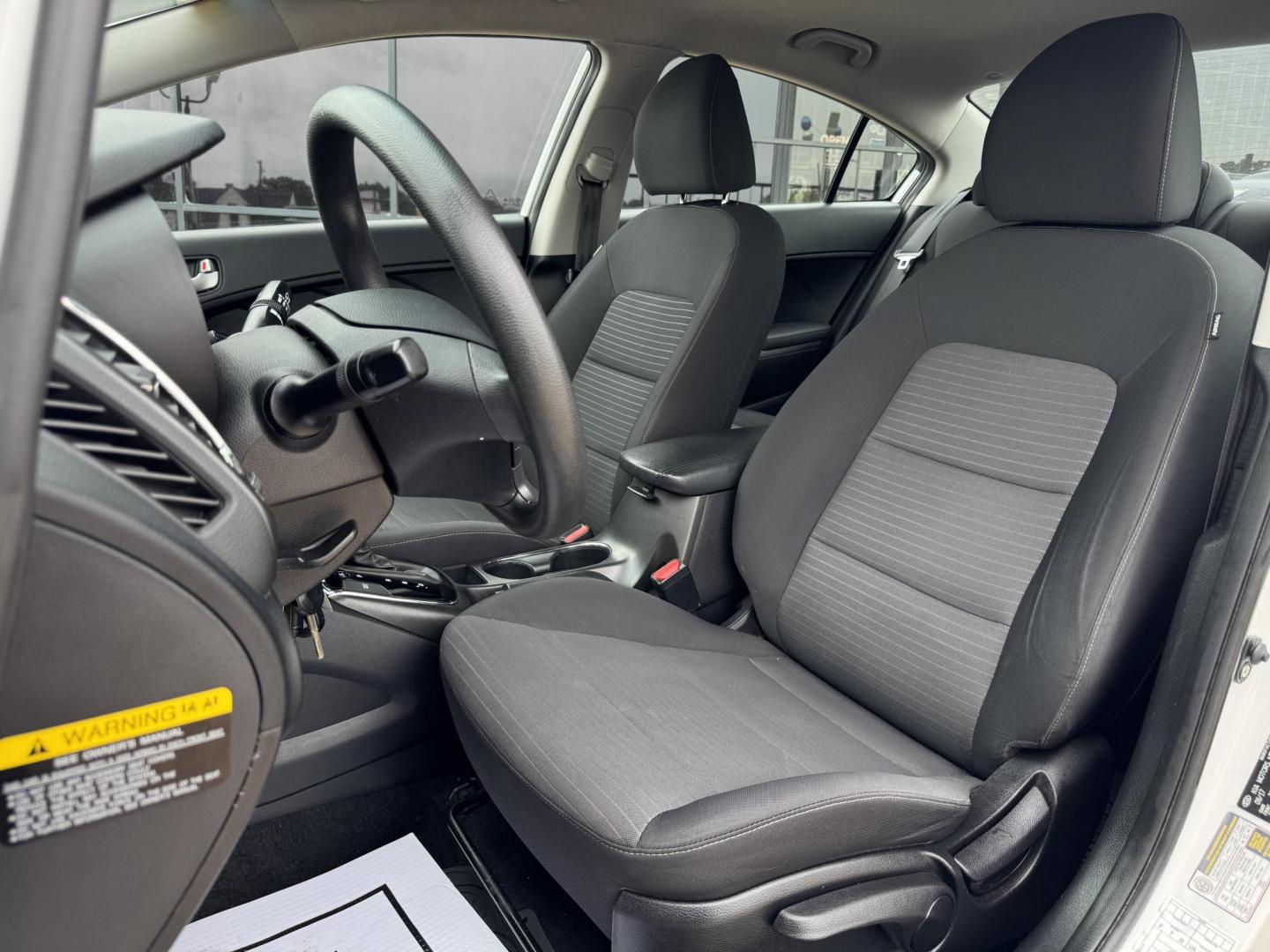 2018 WHITE /BLACK KIA FORTE LX; S LX (3KPFL4A70JE) with an 2.0L engine, 6-Speed Automatic transmission, located at 5900 E. Lancaster Ave., Fort Worth, TX, 76112, (817) 457-5456, 0.000000, 0.000000 - The 2018 Kia Forte LX combines efficiency and comfort with a 2.0L 4-cylinder engine, 6-speed automatic transmission, and impressive 29 city / 37 highway MPG. It seats five with spacious legroom and features a backup camera, phone connectivity, 4-wheel ABS disc brakes, and coil spring suspension. A r - Photo#10