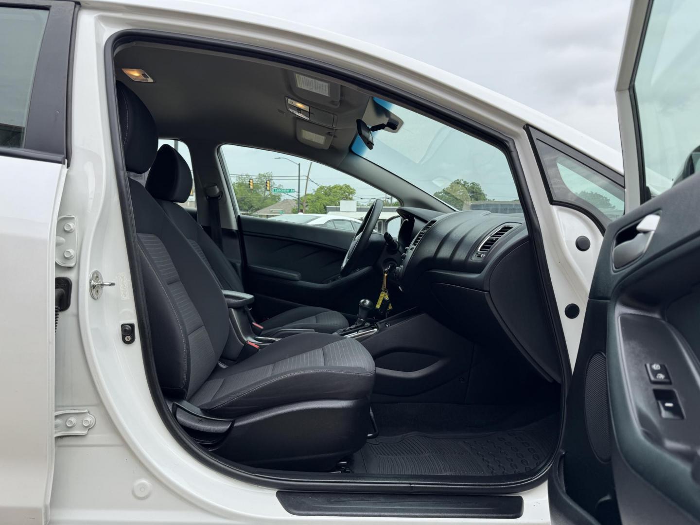 2018 WHITE /BLACK KIA FORTE LX; S LX (3KPFL4A70JE) with an 2.0L engine, 6-Speed Automatic transmission, located at 5900 E. Lancaster Ave., Fort Worth, TX, 76112, (817) 457-5456, 0.000000, 0.000000 - The 2018 Kia Forte LX combines efficiency and comfort with a 2.0L 4-cylinder engine, 6-speed automatic transmission, and impressive 29 city / 37 highway MPG. It seats five with spacious legroom and features a backup camera, phone connectivity, 4-wheel ABS disc brakes, and coil spring suspension. A r - Photo#16