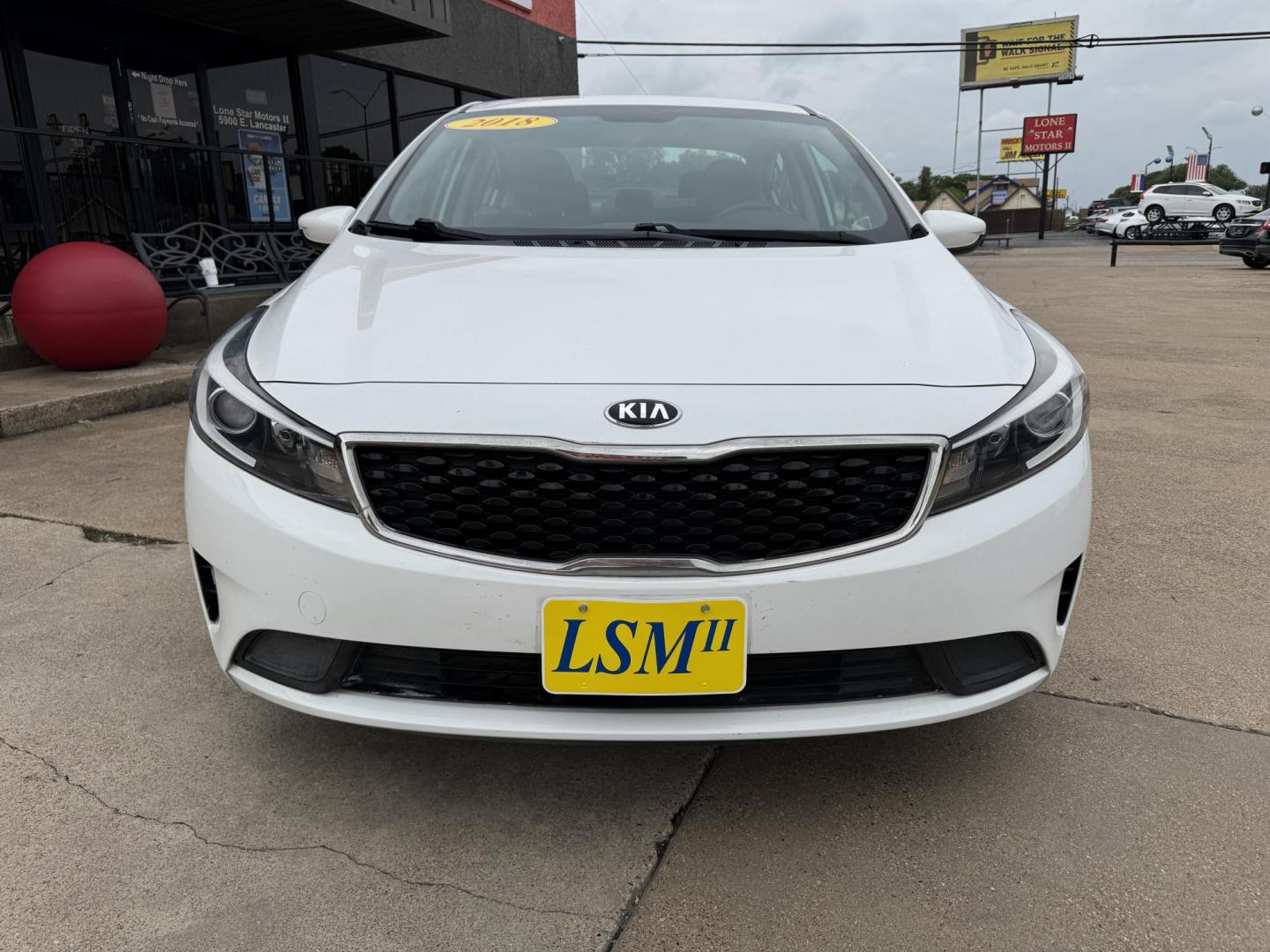 2018 WHITE /BLACK KIA FORTE LX; S LX (3KPFL4A70JE) with an 2.0L engine, 6-Speed Automatic transmission, located at 5900 E. Lancaster Ave., Fort Worth, TX, 76112, (817) 457-5456, 0.000000, 0.000000 - The 2018 Kia Forte LX combines efficiency and comfort with a 2.0L 4-cylinder engine, 6-speed automatic transmission, and impressive 29 city / 37 highway MPG. It seats five with spacious legroom and features a backup camera, phone connectivity, 4-wheel ABS disc brakes, and coil spring suspension. A r - Photo#1