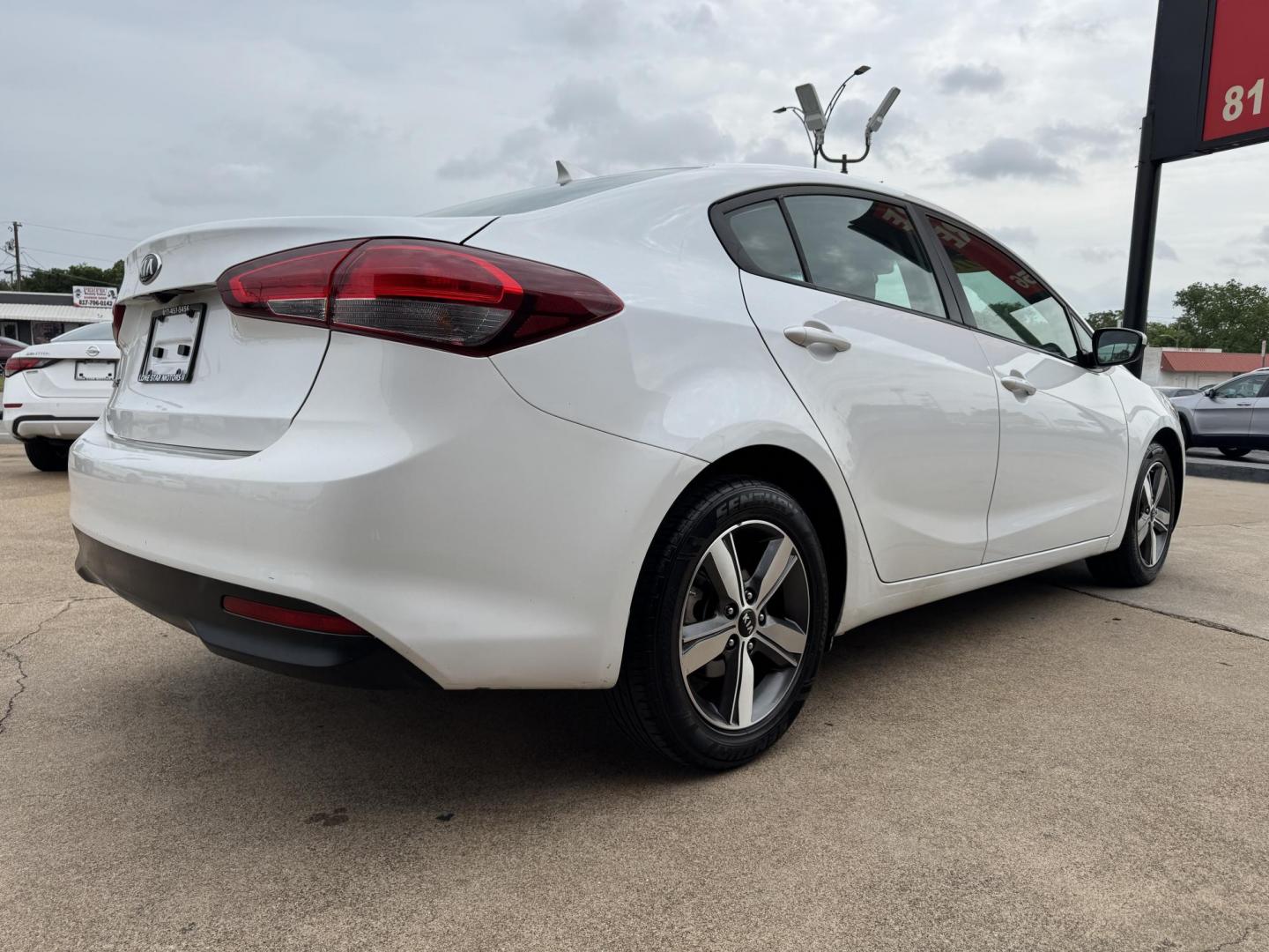 2018 WHITE /BLACK KIA FORTE LX; S LX (3KPFL4A70JE) with an 2.0L engine, 6-Speed Automatic transmission, located at 5900 E. Lancaster Ave., Fort Worth, TX, 76112, (817) 457-5456, 0.000000, 0.000000 - The 2018 Kia Forte LX combines efficiency and comfort with a 2.0L 4-cylinder engine, 6-speed automatic transmission, and impressive 29 city / 37 highway MPG. It seats five with spacious legroom and features a backup camera, phone connectivity, 4-wheel ABS disc brakes, and coil spring suspension. A r - Photo#3