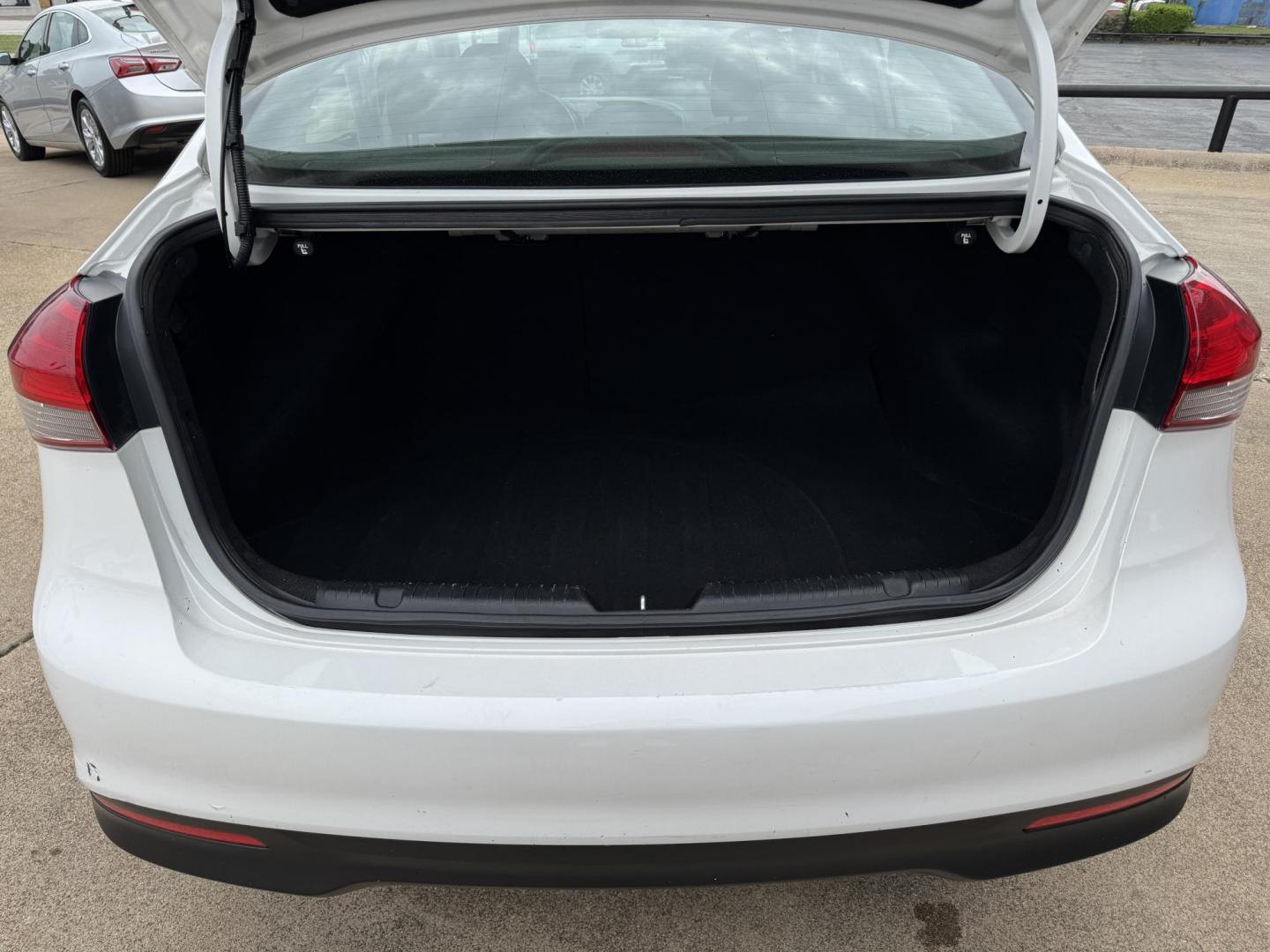 2018 WHITE /BLACK KIA FORTE LX; S LX (3KPFL4A70JE) with an 2.0L engine, 6-Speed Automatic transmission, located at 5900 E. Lancaster Ave., Fort Worth, TX, 76112, (817) 457-5456, 0.000000, 0.000000 - The 2018 Kia Forte LX combines efficiency and comfort with a 2.0L 4-cylinder engine, 6-speed automatic transmission, and impressive 29 city / 37 highway MPG. It seats five with spacious legroom and features a backup camera, phone connectivity, 4-wheel ABS disc brakes, and coil spring suspension. A r - Photo#5