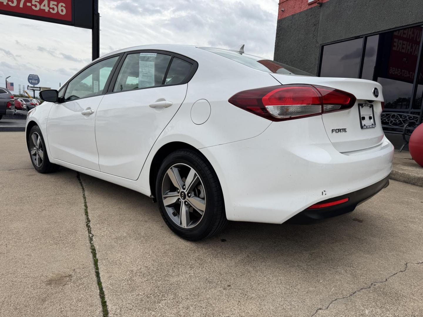 2018 WHITE /BLACK KIA FORTE LX; S LX (3KPFL4A70JE) with an 2.0L engine, 6-Speed Automatic transmission, located at 5900 E. Lancaster Ave., Fort Worth, TX, 76112, (817) 457-5456, 0.000000, 0.000000 - The 2018 Kia Forte LX combines efficiency and comfort with a 2.0L 4-cylinder engine, 6-speed automatic transmission, and impressive 29 city / 37 highway MPG. It seats five with spacious legroom and features a backup camera, phone connectivity, 4-wheel ABS disc brakes, and coil spring suspension. A r - Photo#6