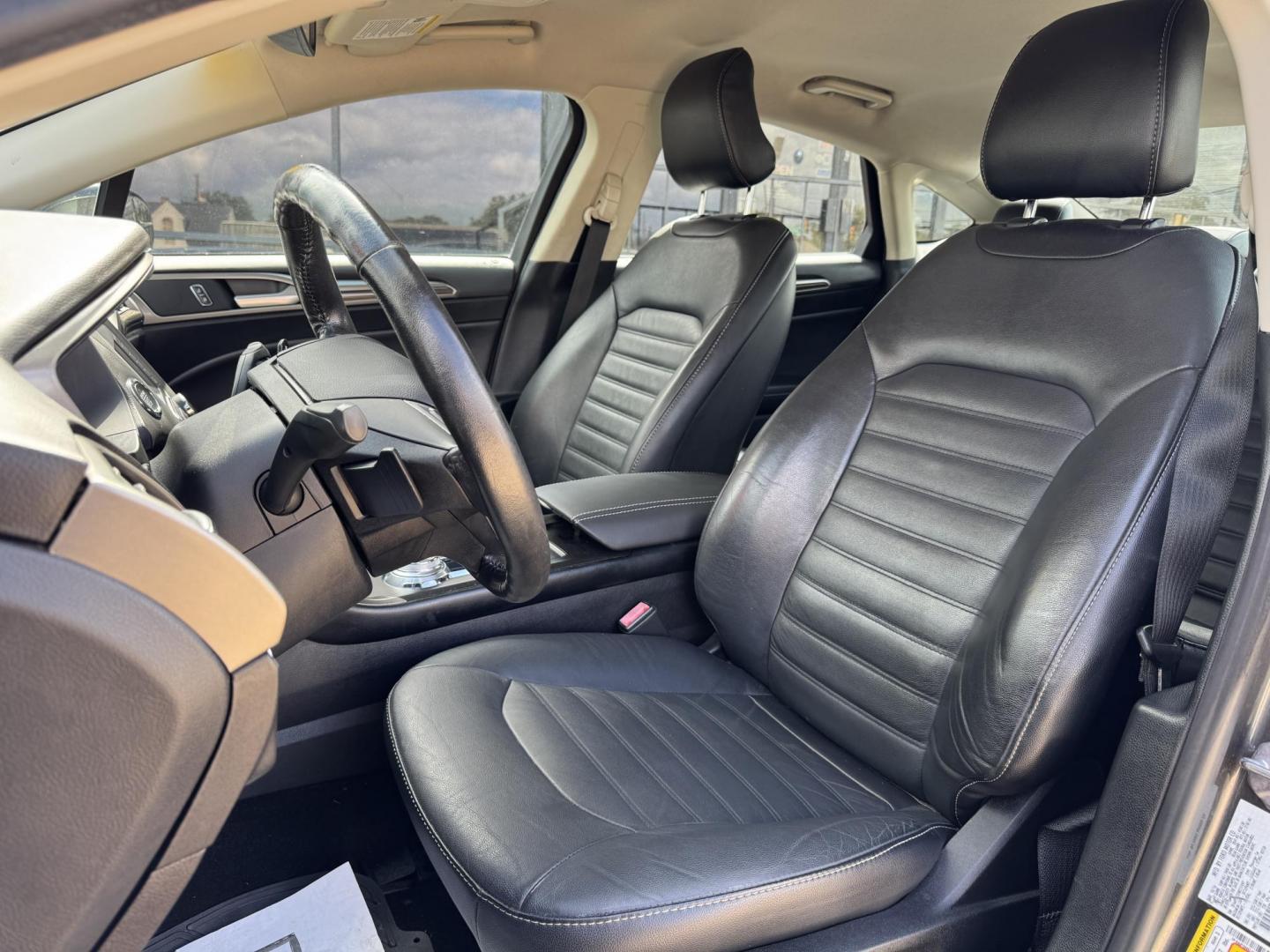 2017 GRAY /BLACK FORD FUSION SE SE (3FA6P0HD2HR) with an 1.5L engine, 6-Speed Automatic transmission, located at 5900 E. Lancaster Ave., Fort Worth, TX, 76112, (817) 457-5456, 0.000000, 0.000000 - The 2017 Ford Fusion SE offers a perfect mix of style and efficiency with its 1.5L 4-cylinder engine and 6-speed automatic transmission, delivering 22 city / 34 highway MPG. This FWD sedan seats five comfortably and comes equipped with backup camera, phone connectivity, alloy wheels, and dual climat - Photo#9