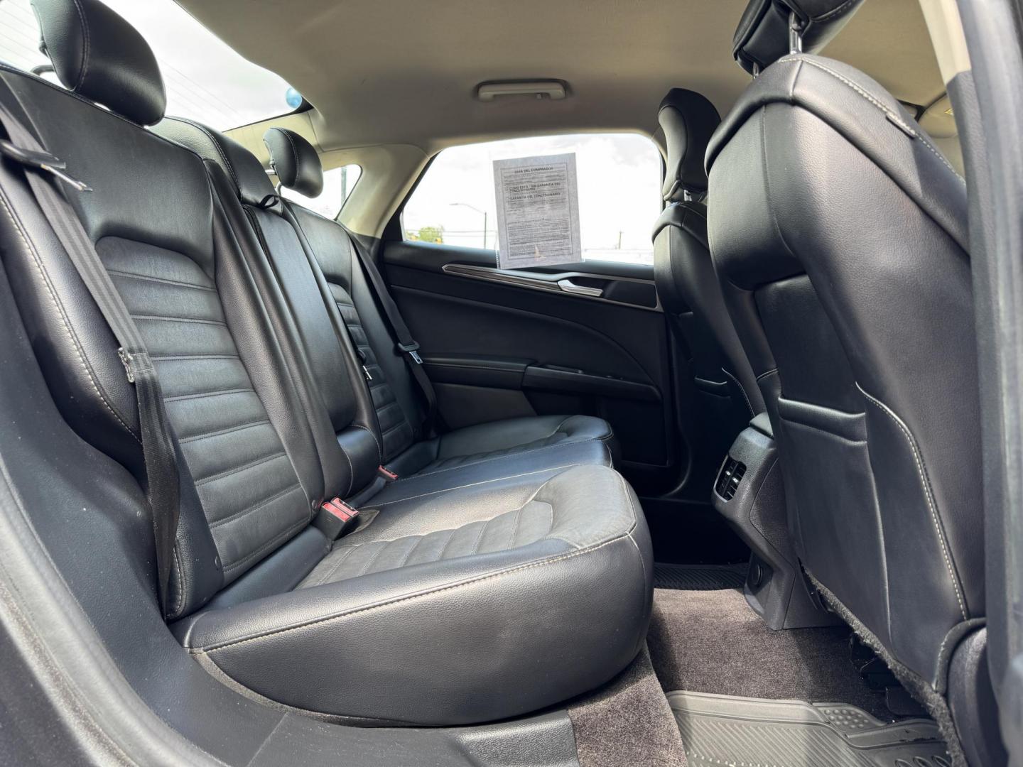 2017 GRAY /BLACK FORD FUSION SE SE (3FA6P0HD2HR) with an 1.5L engine, 6-Speed Automatic transmission, located at 5900 E. Lancaster Ave., Fort Worth, TX, 76112, (817) 457-5456, 0.000000, 0.000000 - The 2017 Ford Fusion SE offers a perfect mix of style and efficiency with its 1.5L 4-cylinder engine and 6-speed automatic transmission, delivering 22 city / 34 highway MPG. This FWD sedan seats five comfortably and comes equipped with backup camera, phone connectivity, alloy wheels, and dual climat - Photo#13