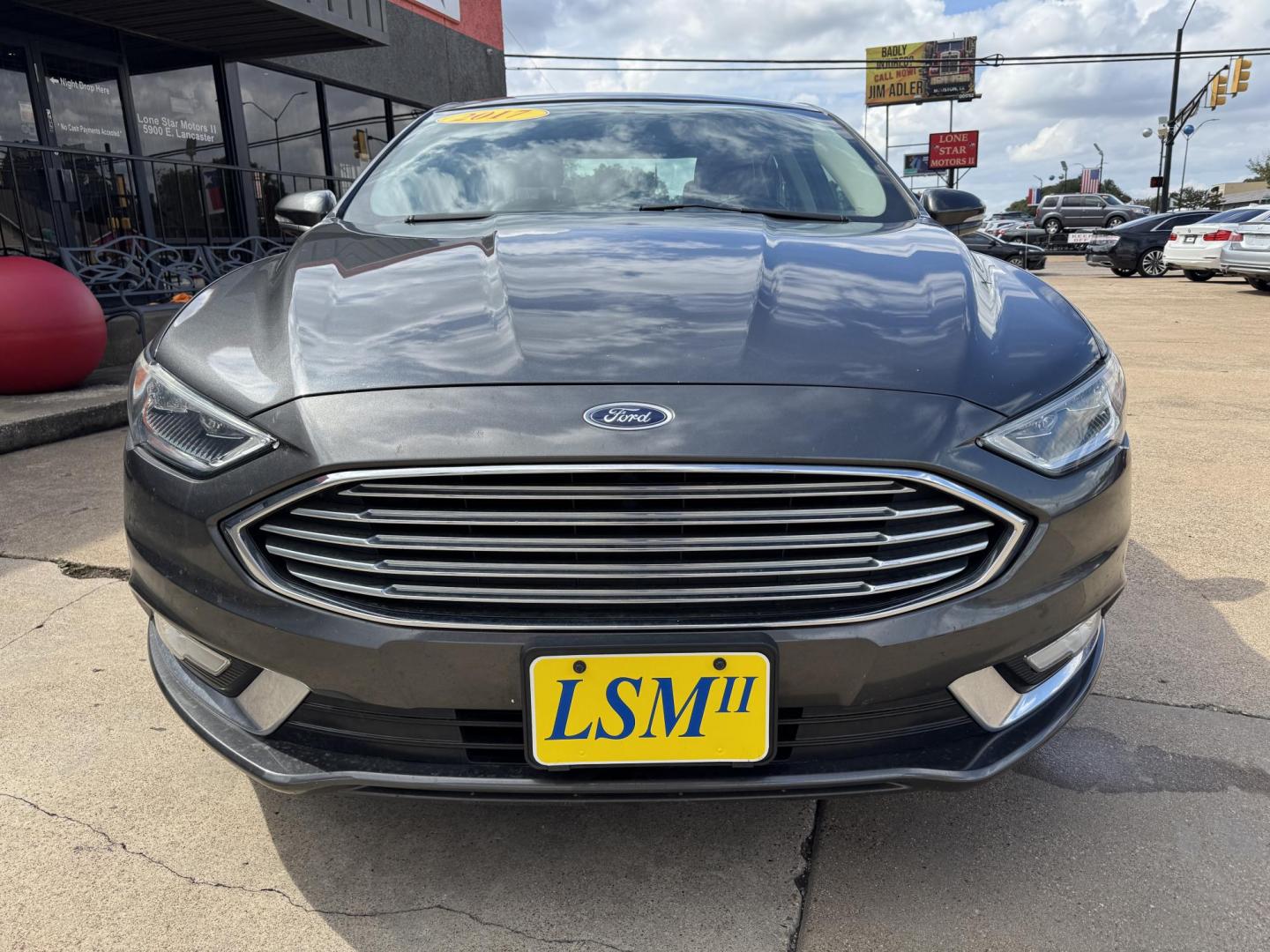2017 GRAY /BLACK FORD FUSION SE SE (3FA6P0HD2HR) with an 1.5L engine, 6-Speed Automatic transmission, located at 5900 E. Lancaster Ave., Fort Worth, TX, 76112, (817) 457-5456, 0.000000, 0.000000 - The 2017 Ford Fusion SE offers a perfect mix of style and efficiency with its 1.5L 4-cylinder engine and 6-speed automatic transmission, delivering 22 city / 34 highway MPG. This FWD sedan seats five comfortably and comes equipped with backup camera, phone connectivity, alloy wheels, and dual climat - Photo#1