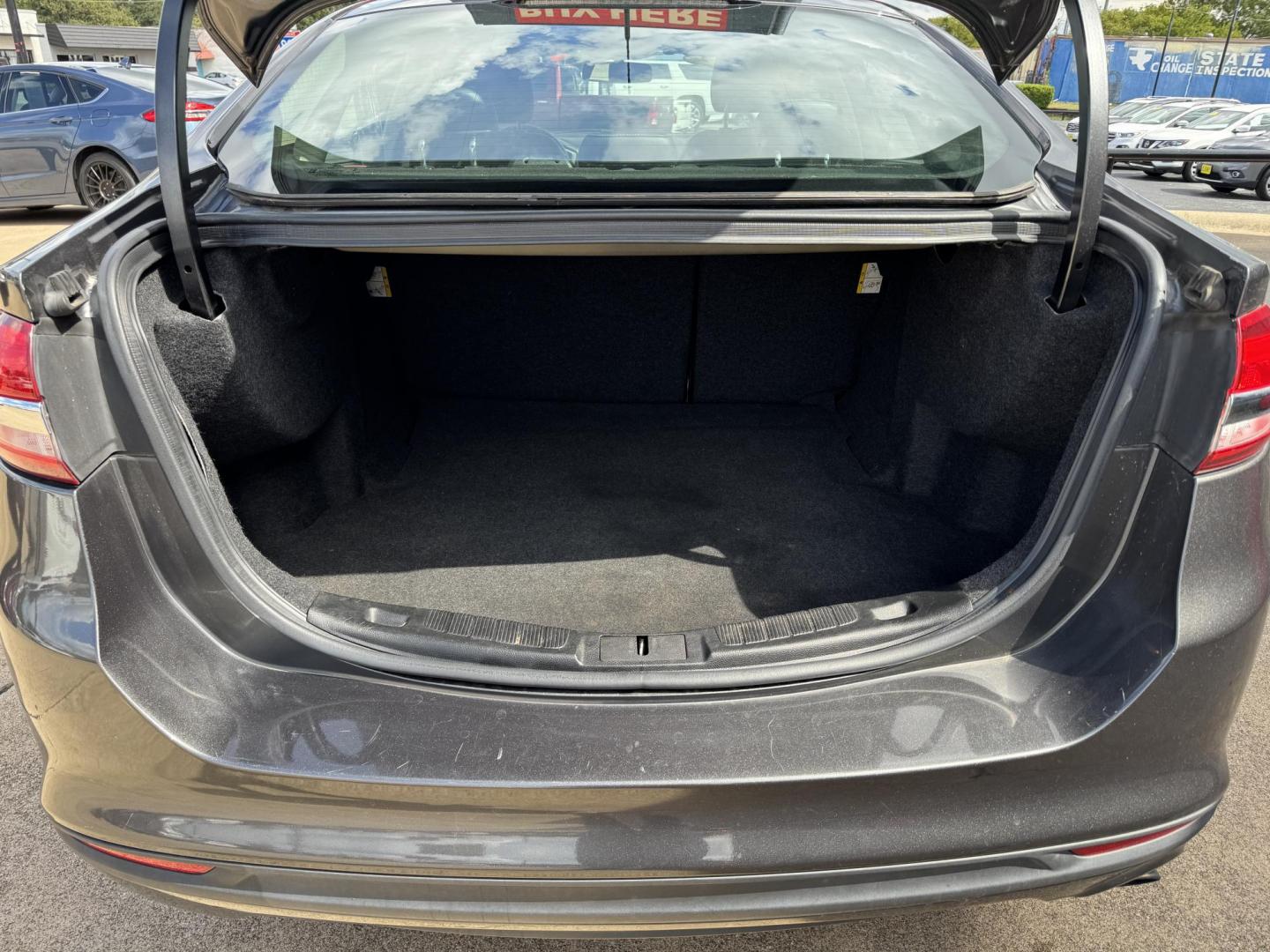 2017 GRAY /BLACK FORD FUSION SE SE (3FA6P0HD2HR) with an 1.5L engine, 6-Speed Automatic transmission, located at 5900 E. Lancaster Ave., Fort Worth, TX, 76112, (817) 457-5456, 0.000000, 0.000000 - The 2017 Ford Fusion SE offers a perfect mix of style and efficiency with its 1.5L 4-cylinder engine and 6-speed automatic transmission, delivering 22 city / 34 highway MPG. This FWD sedan seats five comfortably and comes equipped with backup camera, phone connectivity, alloy wheels, and dual climat - Photo#5