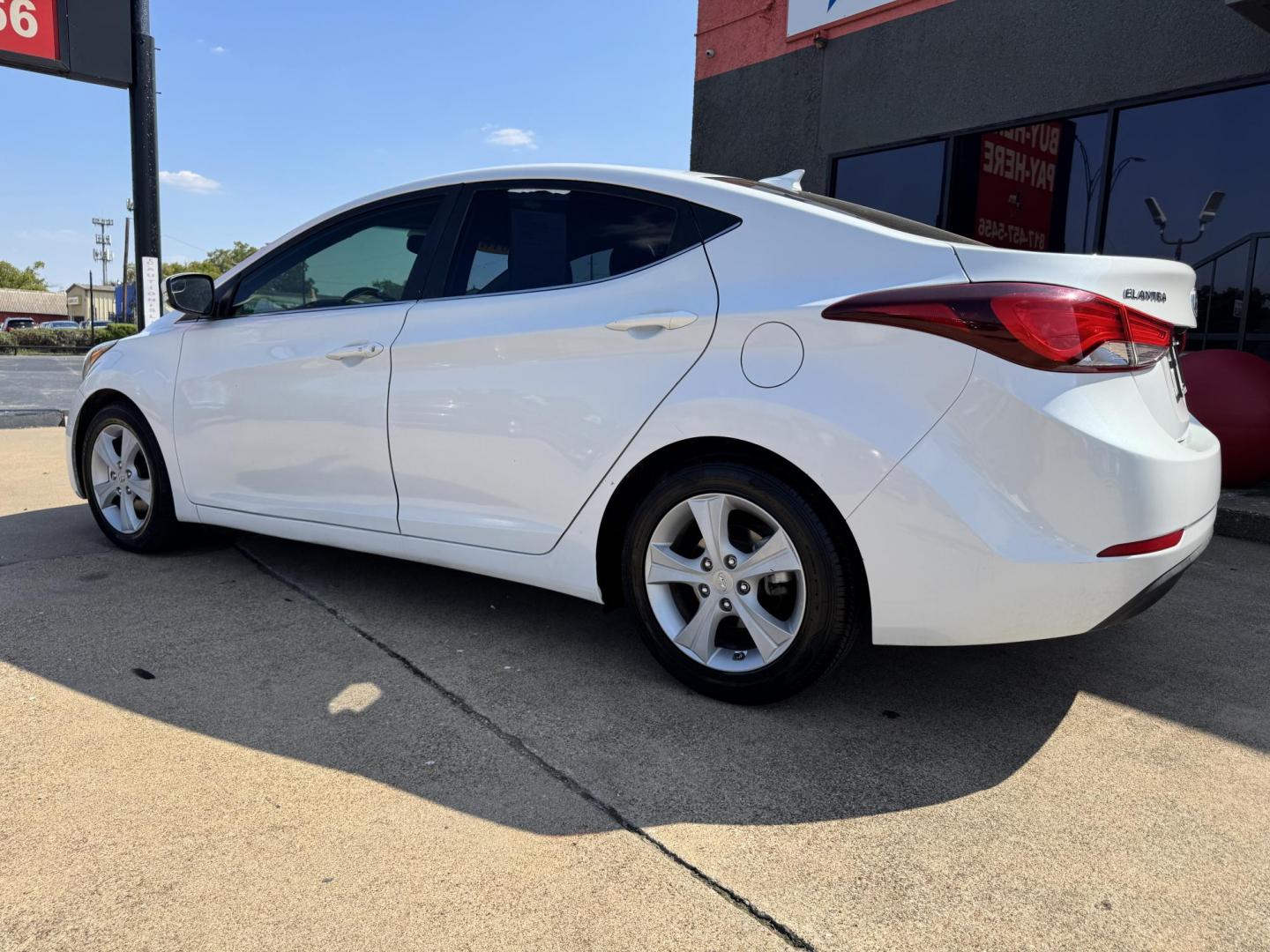 2016 WHITE /TAN HYUNDAI ELANTRA LIMITED; SE; LIMITIED (5NPDH4AEXGH) with an 1.8L engine, 6-Speed Automatic transmission, located at 5900 E. Lancaster Ave., Fort Worth, TX, 76112, (817) 457-5456, 0.000000, 0.000000 - Check out this 2016 Hyundai Elantra Limited, a reliable sedan with seating for five. It features front heated seats, push-to-start, a backup camera, and comfortable cloth interior. With a fuel-efficient 1.8L engine and smooth 6-speed automatic transmission, it’s ready for your daily drives around - Photo#6