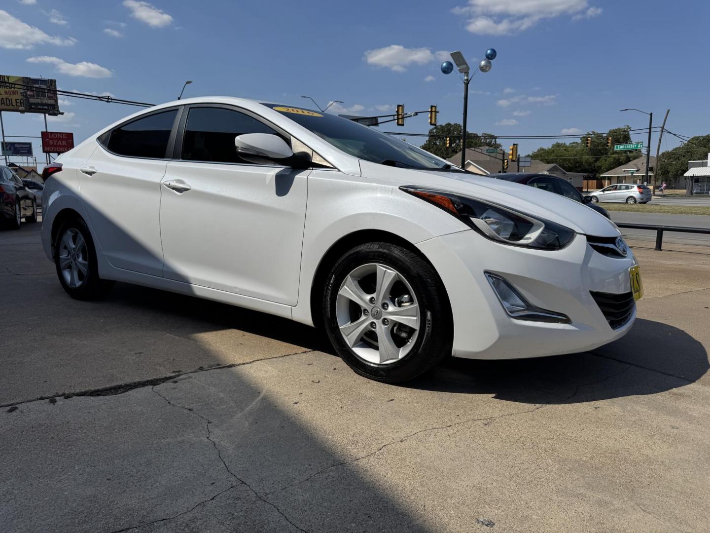 2016 WHITE /TAN HYUNDAI ELANTRA LIMITED; SE; LIMITIED (5NPDH4AEXGH) with an 1.8L engine, 6-Speed Automatic transmission, located at 5900 E. Lancaster Ave., Fort Worth, TX, 76112, (817) 457-5456, 0.000000, 0.000000 - Check out this 2016 Hyundai Elantra Limited, a reliable sedan with seating for five. It features front heated seats, push-to-start, a backup camera, and comfortable cloth interior. With a fuel-efficient 1.8L engine and smooth 6-speed automatic transmission, it’s ready for your daily drives around - Photo#2