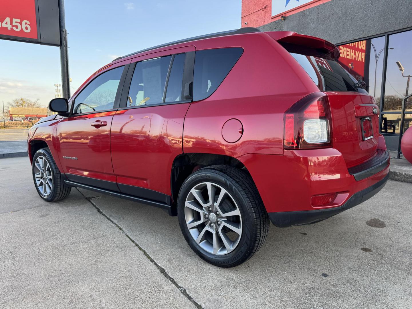 2017 RED JEEP COMPASS LATITUDE (1C4NJCBA4HD) , located at 5900 E. Lancaster Ave., Fort Worth, TX, 76112, (817) 457-5456, 0.000000, 0.000000 - Photo#6