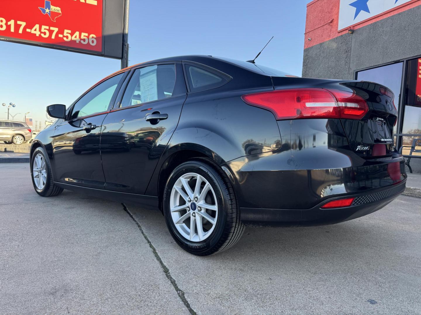2015 BLACK FORD FOCUS SE (1FADP3F24FL) , located at 5900 E. Lancaster Ave., Fort Worth, TX, 76112, (817) 457-5456, 0.000000, 0.000000 - Photo#6