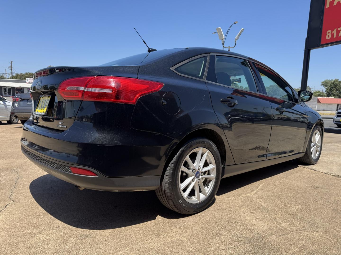 2015 BLACK FORD FOCUS SE (1FADP3F24FL) , located at 5900 E. Lancaster Ave., Fort Worth, TX, 76112, (817) 457-5456, 0.000000, 0.000000- Photo#3