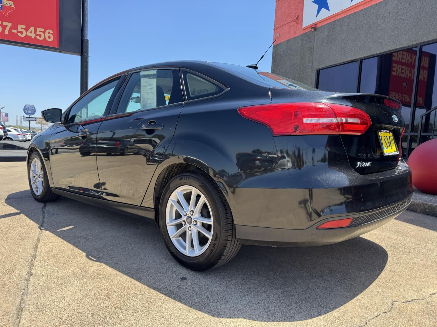 2015 BLACK FORD FOCUS SE (1FADP3F24FL) , located at 5900 E. Lancaster Ave., Fort Worth, TX, 76112, (817) 457-5456, 0.000000, 0.000000- Photo#6